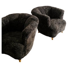 Pair of Swedish Curved Arm Easy Chairs in Charcoal Sheepskin Produced, 1940s
