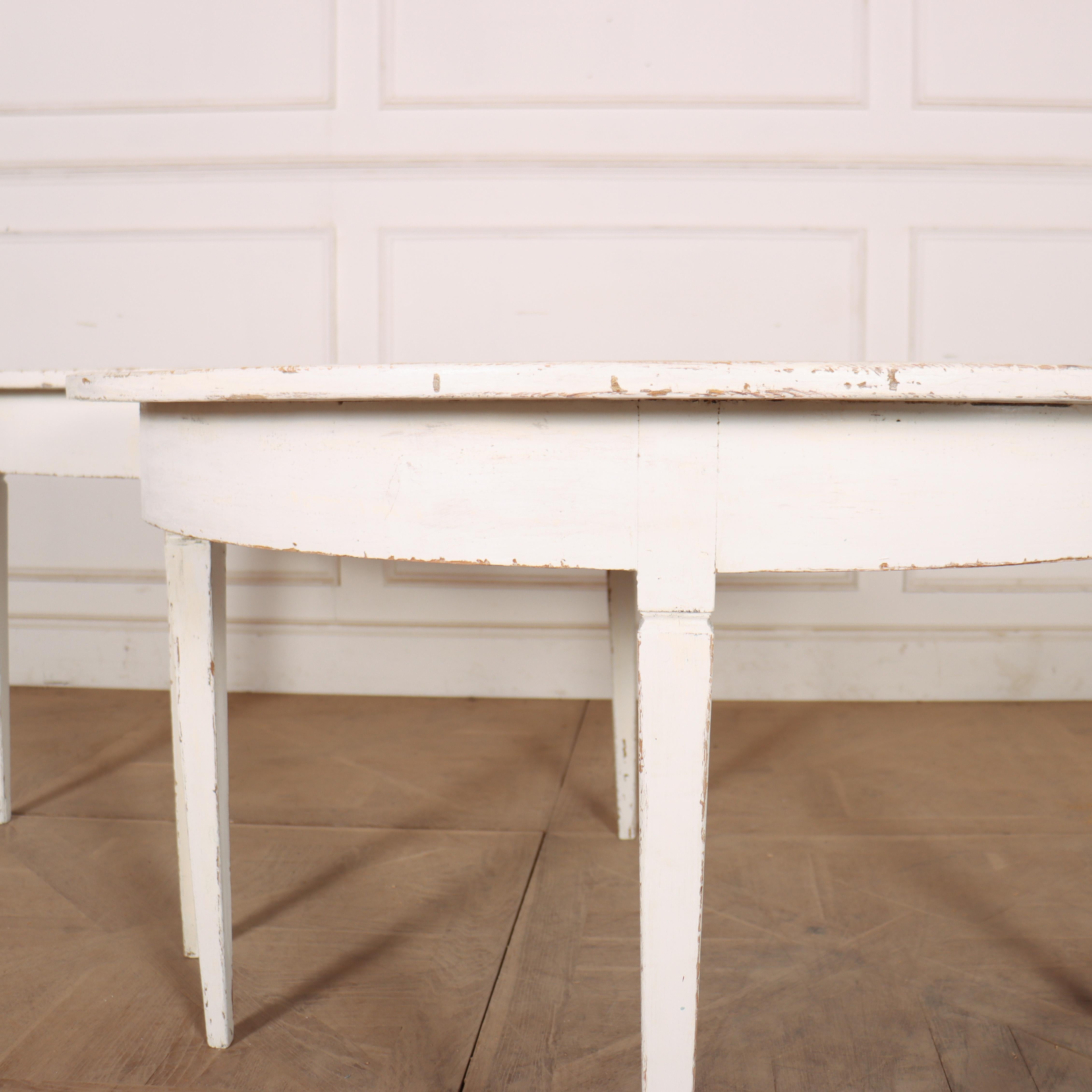 Early 19th century pair of Swedish painted pine demi-lune console tables. 1830.  


Code: 8947

Dimensions:
W: 47