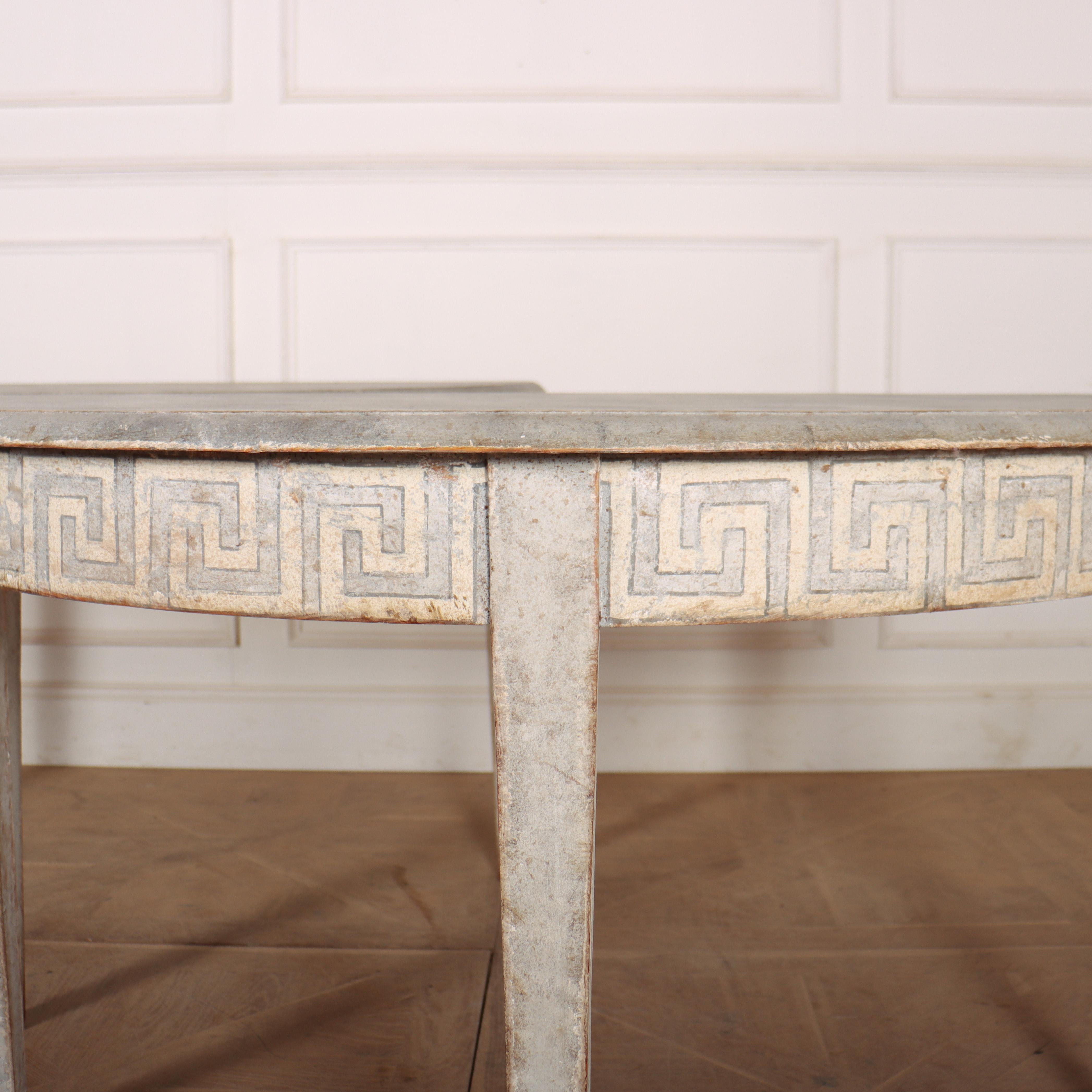 Wonderful pair of Swedish demi lune console tables with Greek key decoration to the friezes and a faux marble tops. 1820.

Code: 8510

Dimensions:
W: 50.5