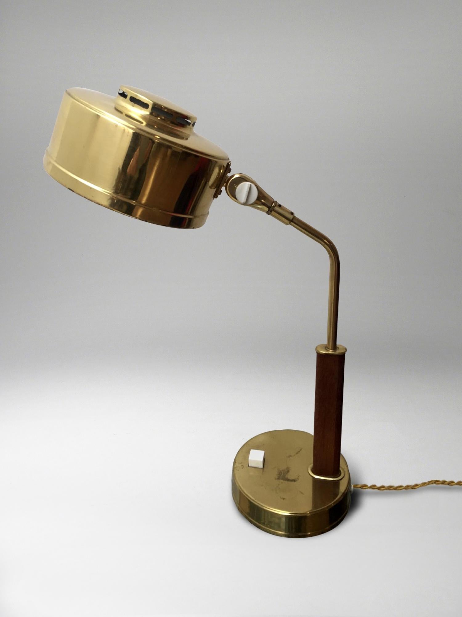 Handsome pair of desk lamps in brass and wood, with pivoting shades
by Bröderna Johansson Auto-Metallfabrik., Skellefteå (BJS), Model 51/M.
Each with stamped marks 'BJS Skellefteå Sweden' and with 'S' paper label.

Founded in 1946, BJS was owned
