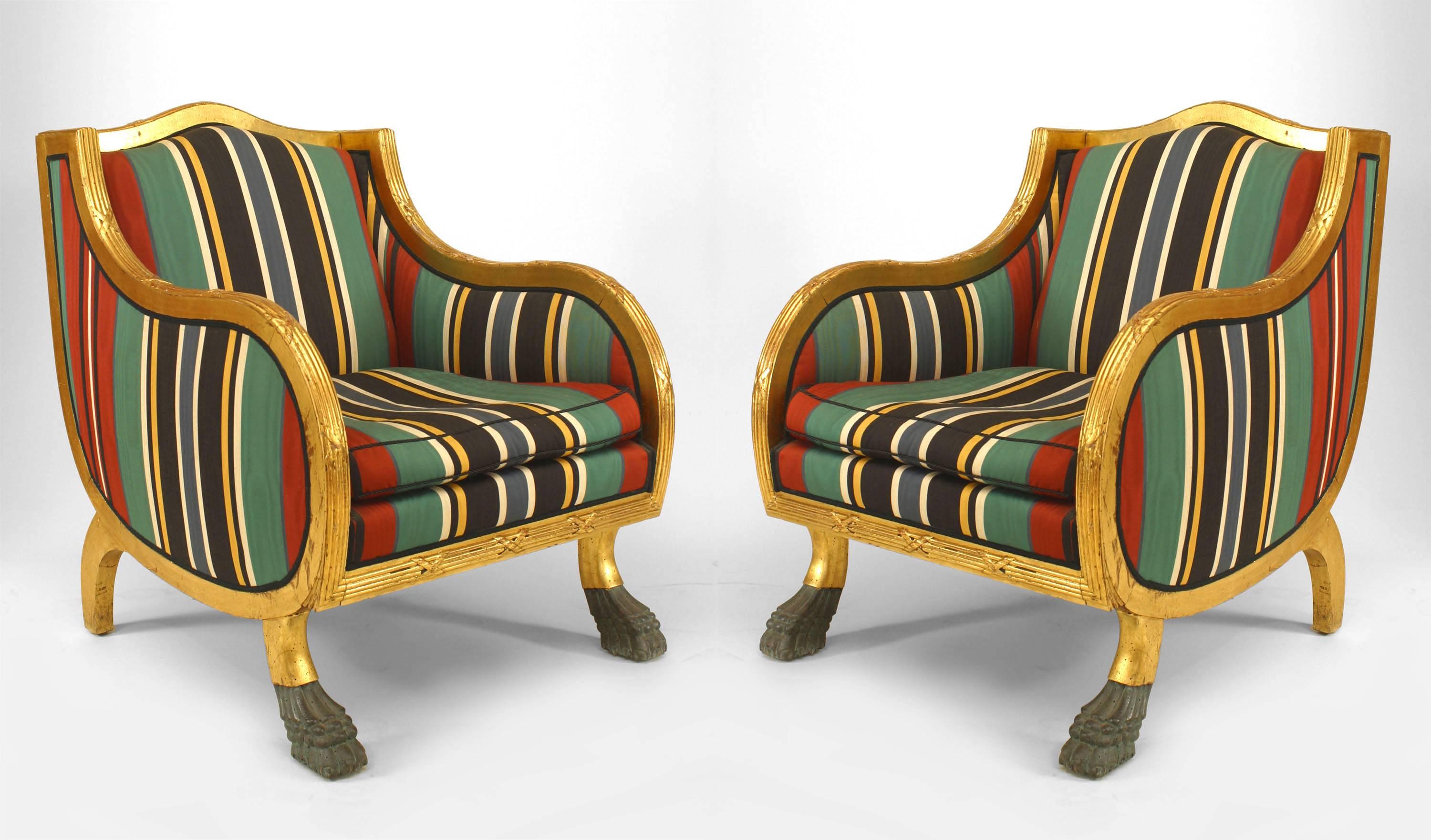 Pair of Swedish Empire-style (20th Century) gilt club chairs with green lacquered claw feet and stripe upholstery (PRICED AS Pair)
