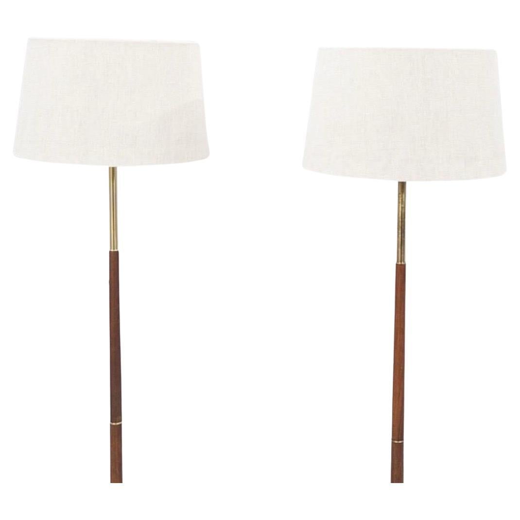 Pair of Swedish floor lamps, teak/brass, Sweden, 1960, in its all original stage elegant simplistic  Scandinavian 1960s design consisting of smooth teak with brass details.

Priced each.