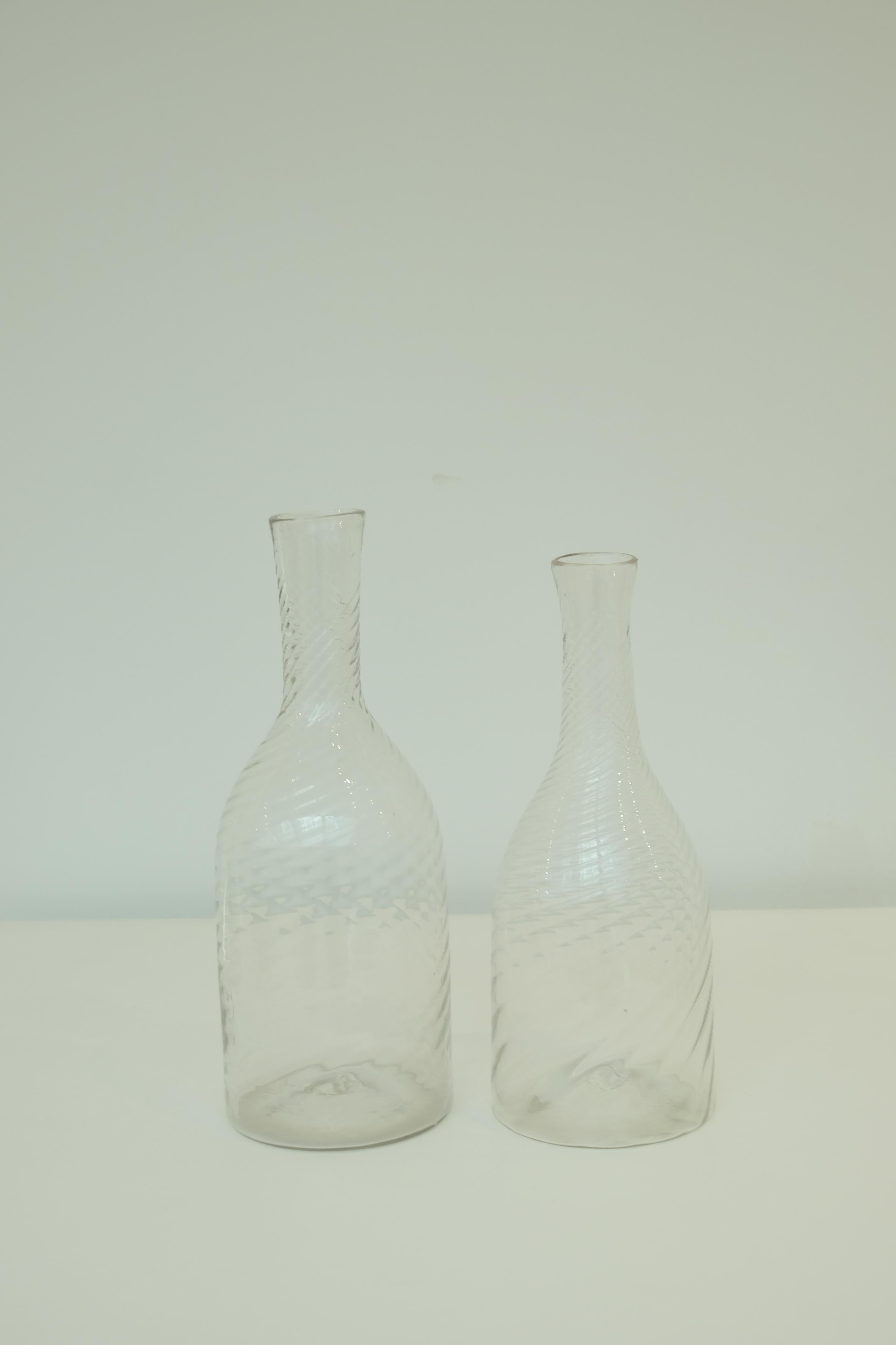 Scandinavian glass decanters, circa 1880. When water is poured from the decanter, it causes a wonderful swirl effect to the stream. Classical, modern and so elegant.