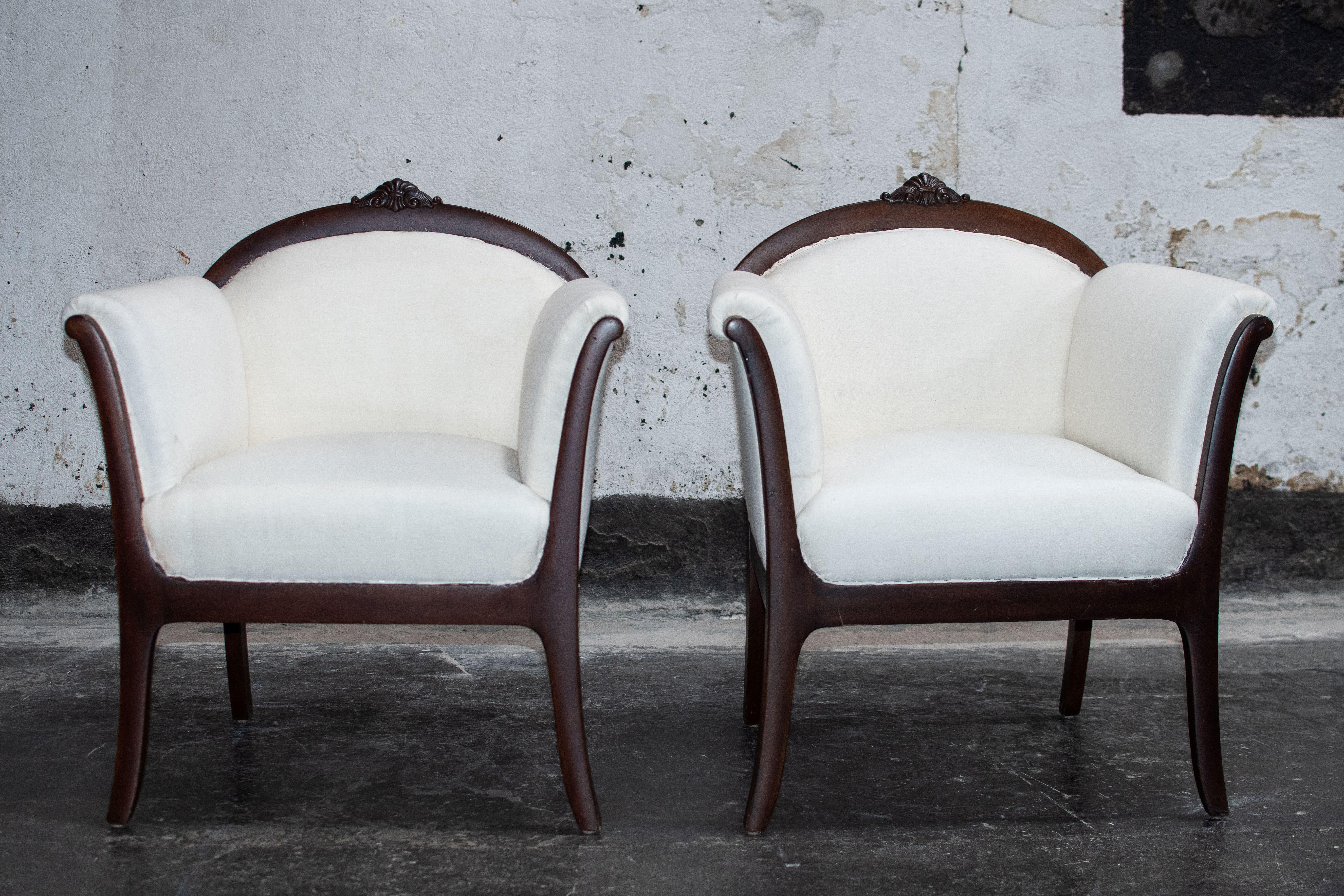Pair of newly restored antique Swedish Grace arm chairs. Swedish Grace was the brief design period precursing the more commonly identified Scandinavian Modern. It is a delicate balance of neoclassical elements and techniques paired with simplified