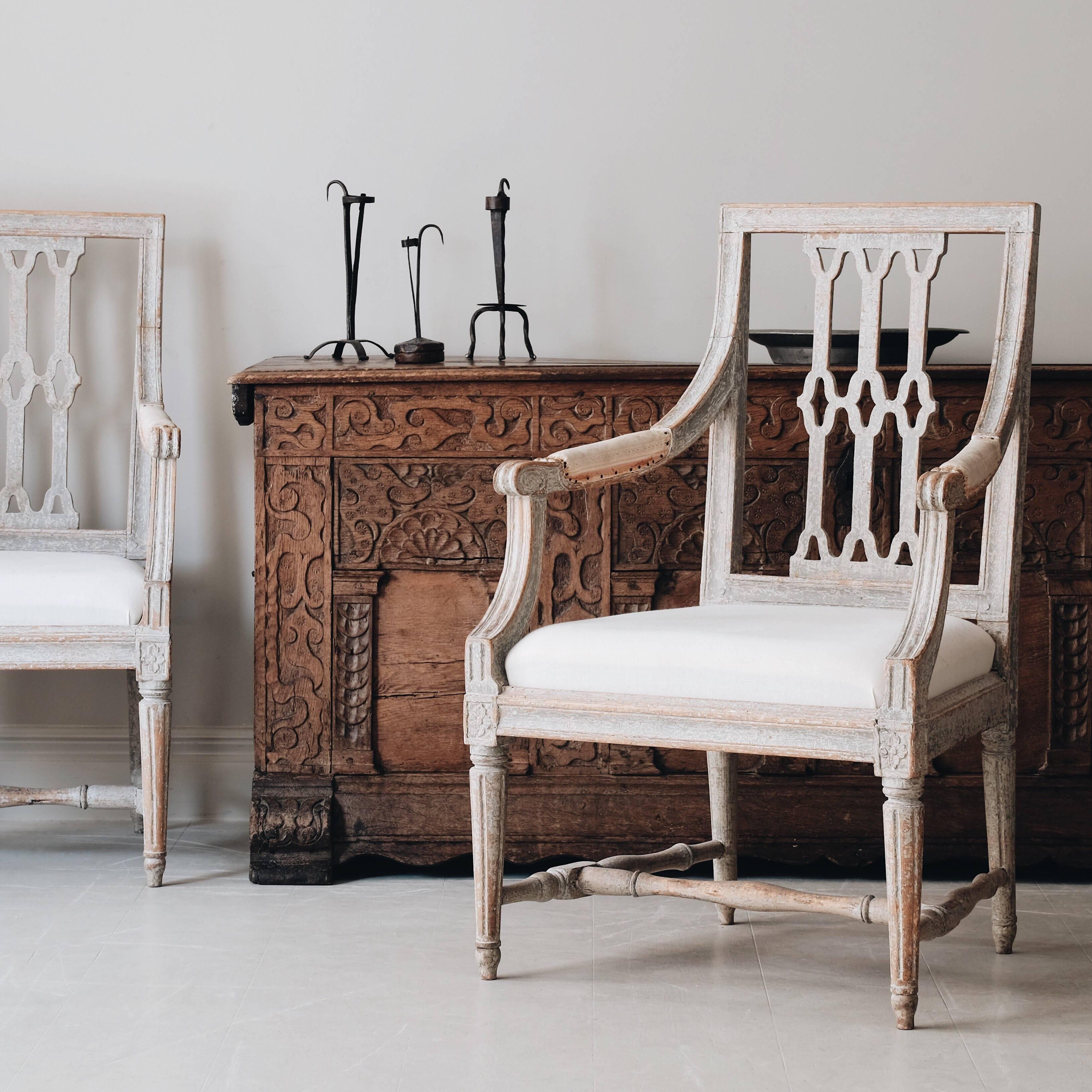 Pair of fine 18th century Gustavian armchairs in original color and a very unusual back splat. Marked with the seal of Stockholm chair maker’s guild, circa 1790, Stockholm Sweden.