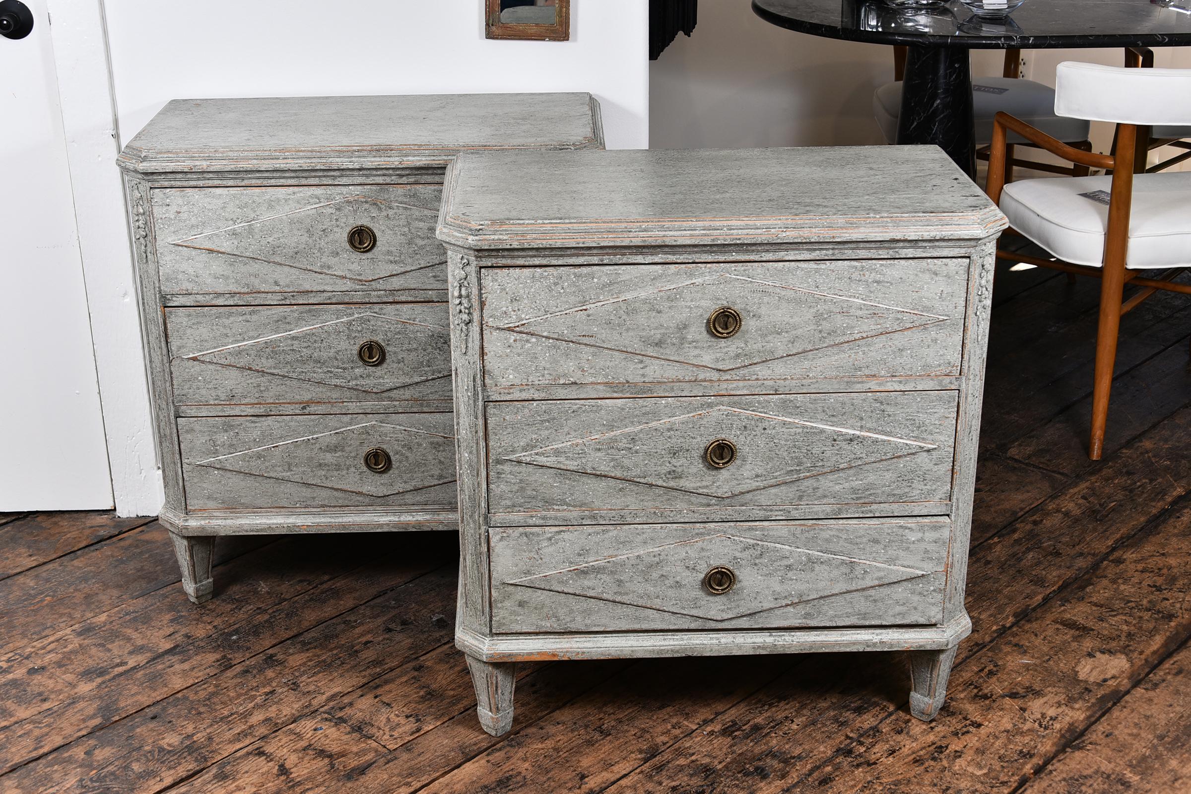 Pair of Swedish Gustavian chest circa 1810-1815. Scraped paint finish. Nice carving and details with a fluted foot.