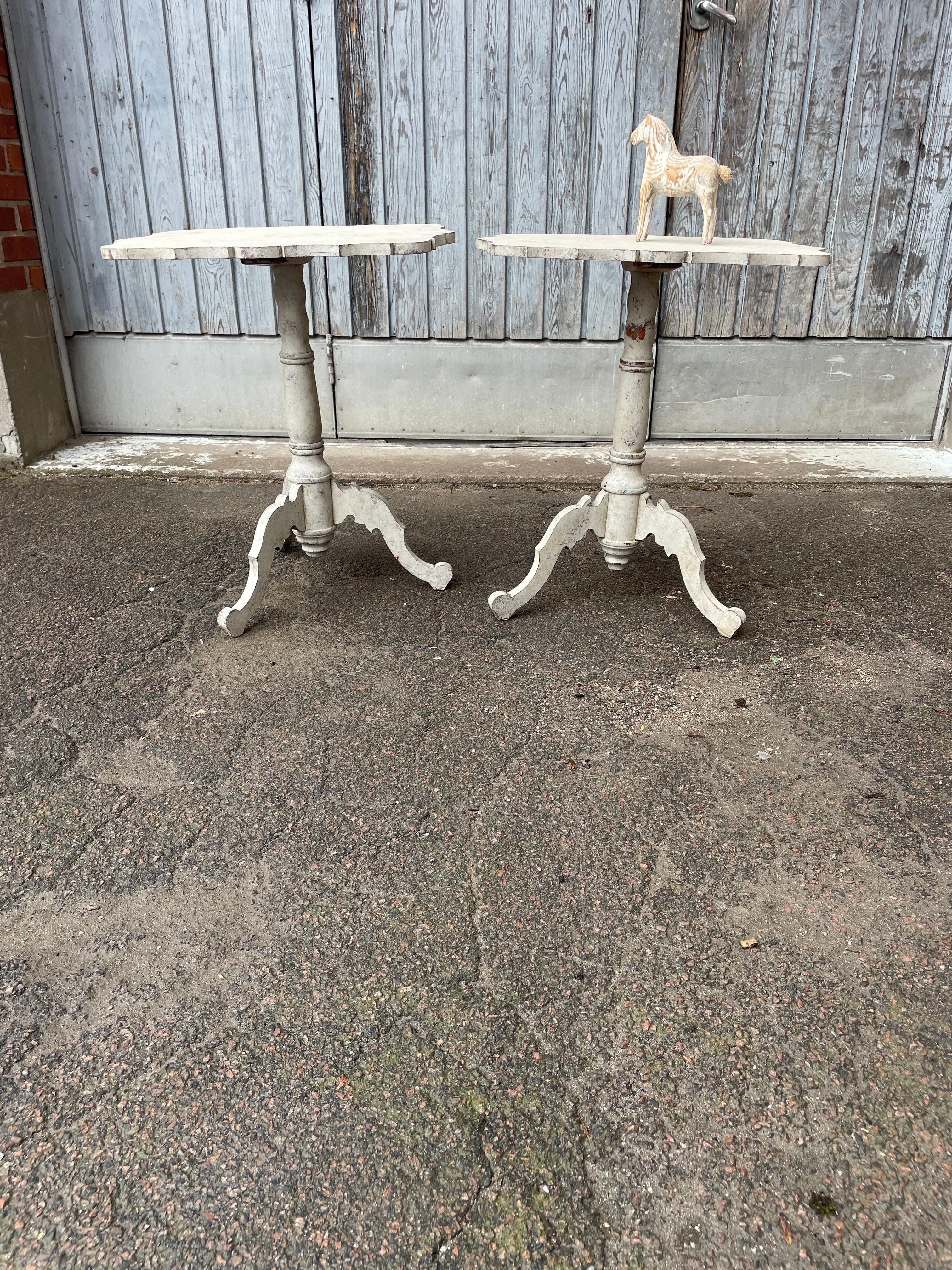 Swedish Pair of Gustavian Painted Side Lamp Tables

A fantastic pair of painted wood side tables from the early 19th Century, with  scalloped tops, turned pedestals and distressed patina. These painted guéridon tables feature elegant tops with