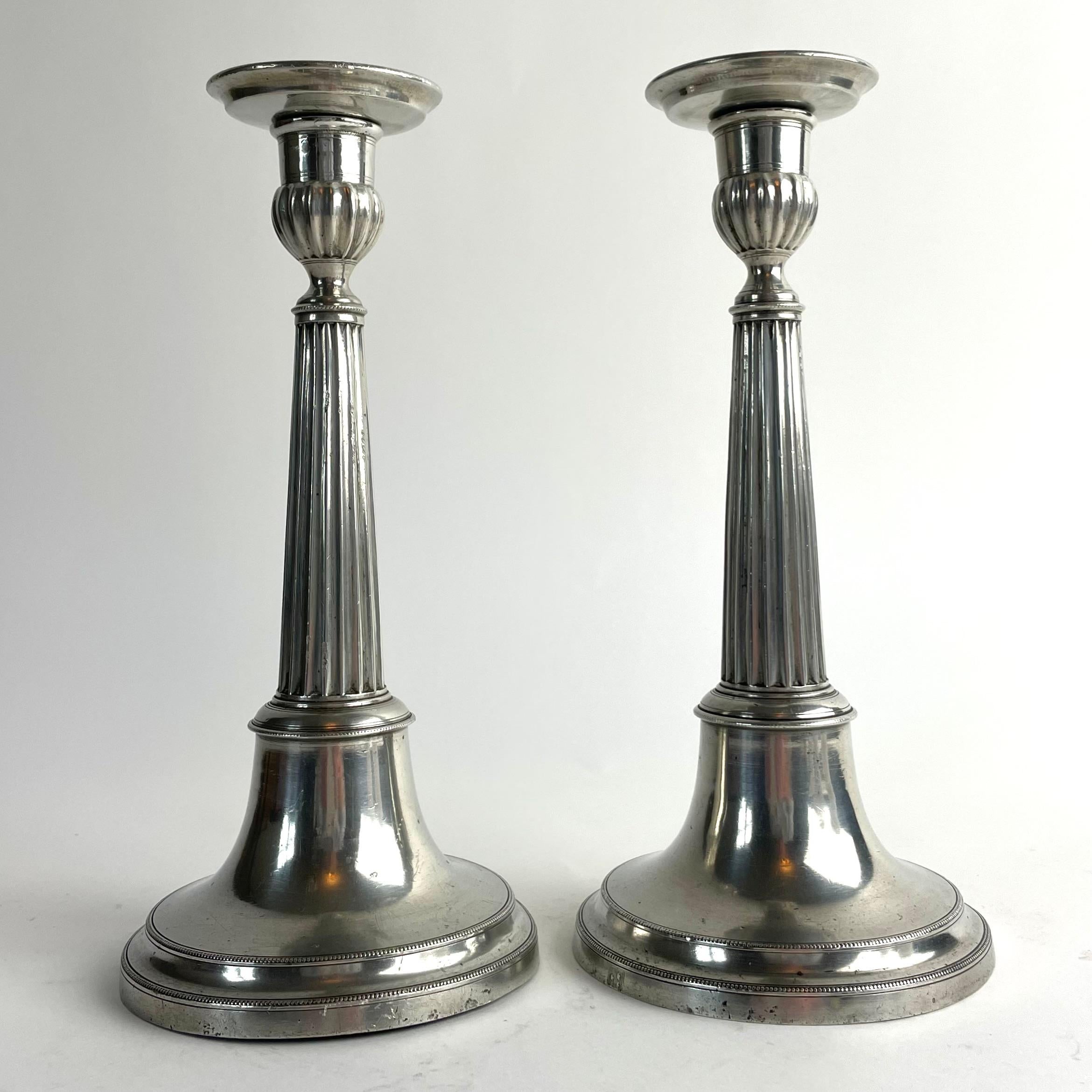 
Pair of Swedish Gustavian Pewter Candlesticks, Johan Fredrik Gellerstedt, 1833

An elegant pair of late Gustavian pewter candlesticks, crafted in Härnösand, Sweden, by the pewter master Johan Fredrik Gellerstedt (1798–1818/36). Marked C4 for the