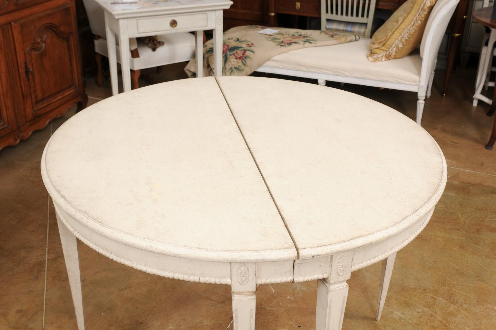Wood Pair of Swedish Gustavian Style 1880s Painted Demilune Tables with Carved Motifs For Sale