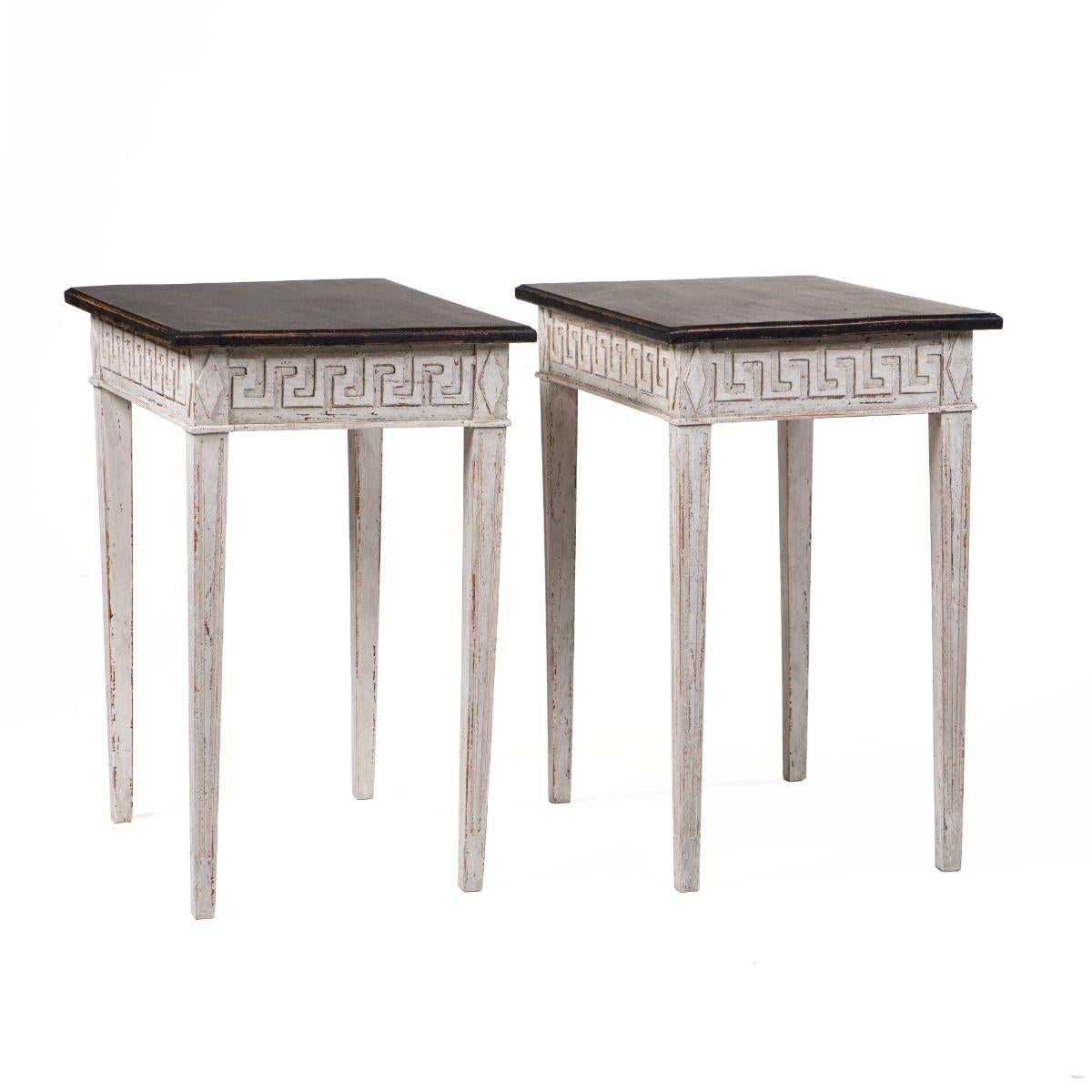 Pair of Swedish Gustavian Style Console Tables, circa 1880–1900

Pair of Swedish console tables in classic Gustavian style.

The tables feature black-painted tops with a profiled edge and a base in light grey paint.
The apron is adorned with a