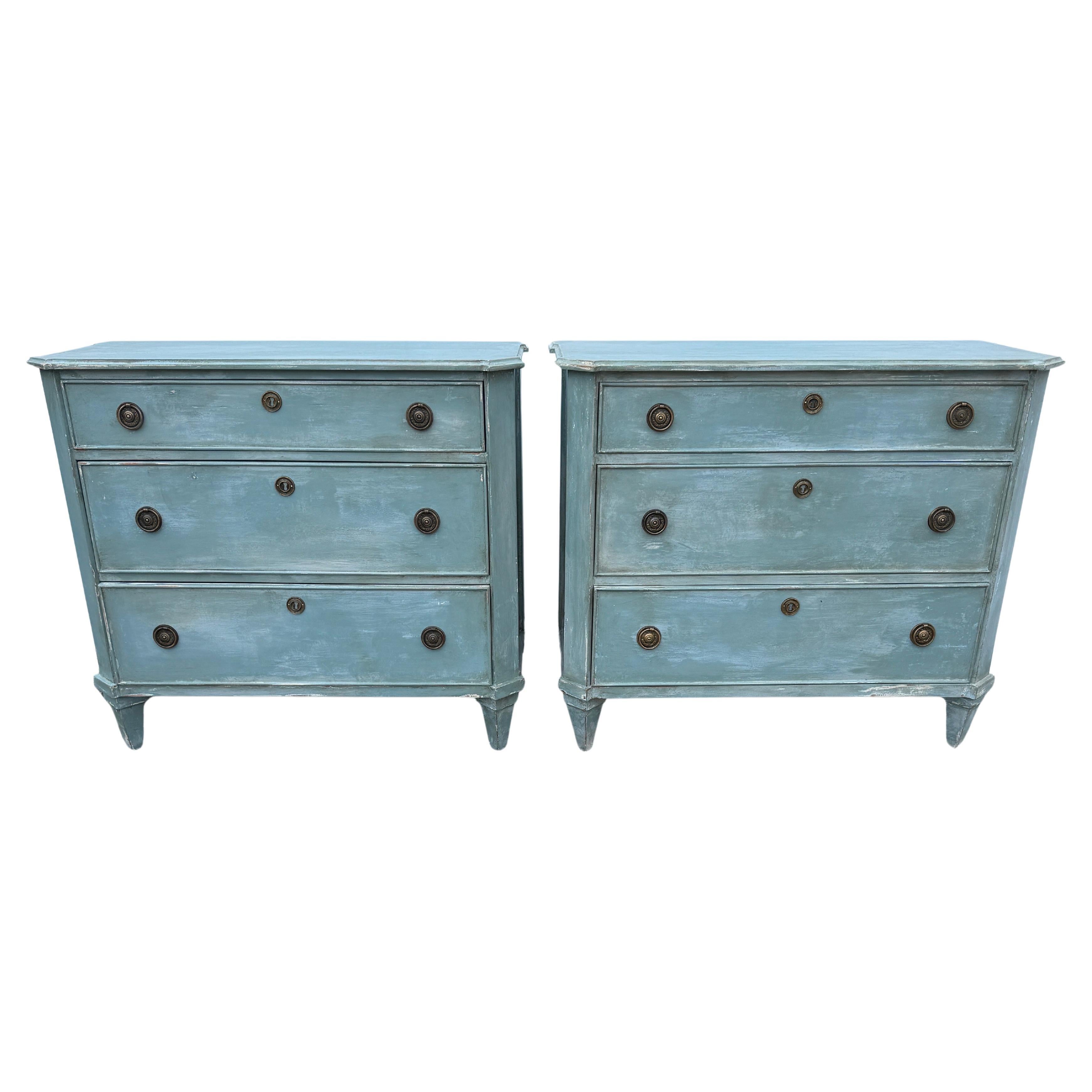 Blue Painted Swedish Gustavian Style 3 Drawer Chest Bureau, A Pair

This pair of three drawer bureaus are based on an 18th Century Gustavian antique chest. They are handmade and hand painted with solid wood legs and frame. The detailing is