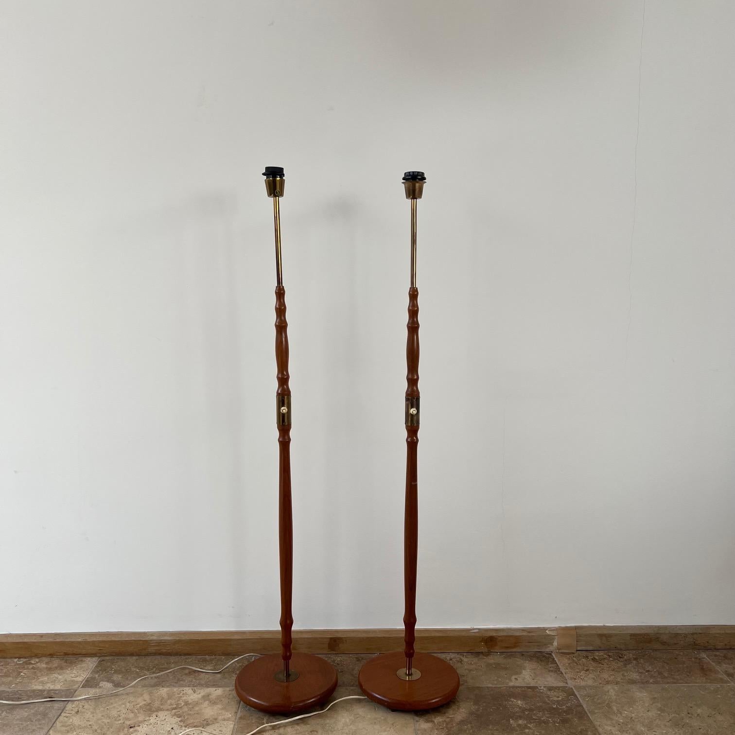 A pair of teak and brass floor lamps. 

Sweden, c1970s. 

Stamped OA to underside. 

Good vintage condition, one looks to have a slight turn. 

Since re-wired and PAT tested.

Price is for the pair. 

Location: London