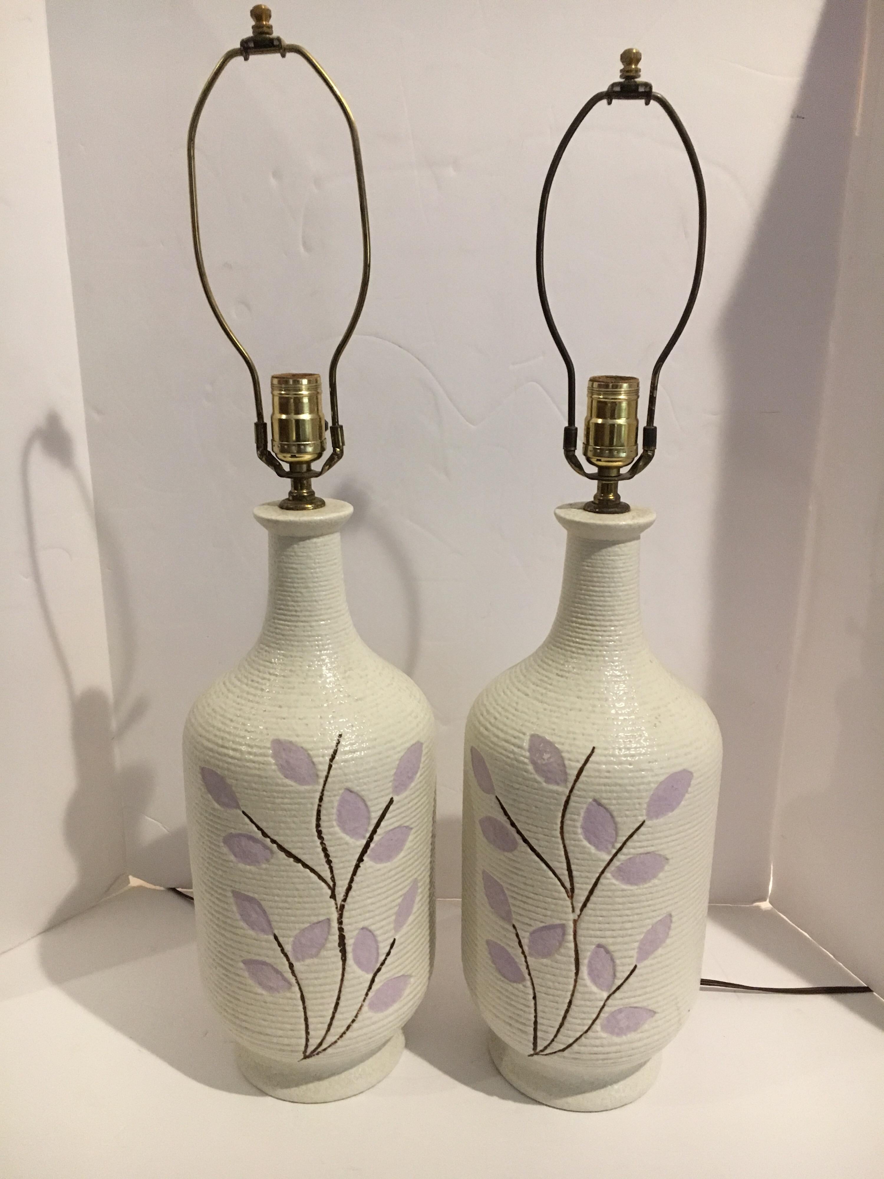 Lovely pair of white ceramic table lamps with lavender flowers made in Sweden, circa 1960s.
Wired for USA and working perfectly.