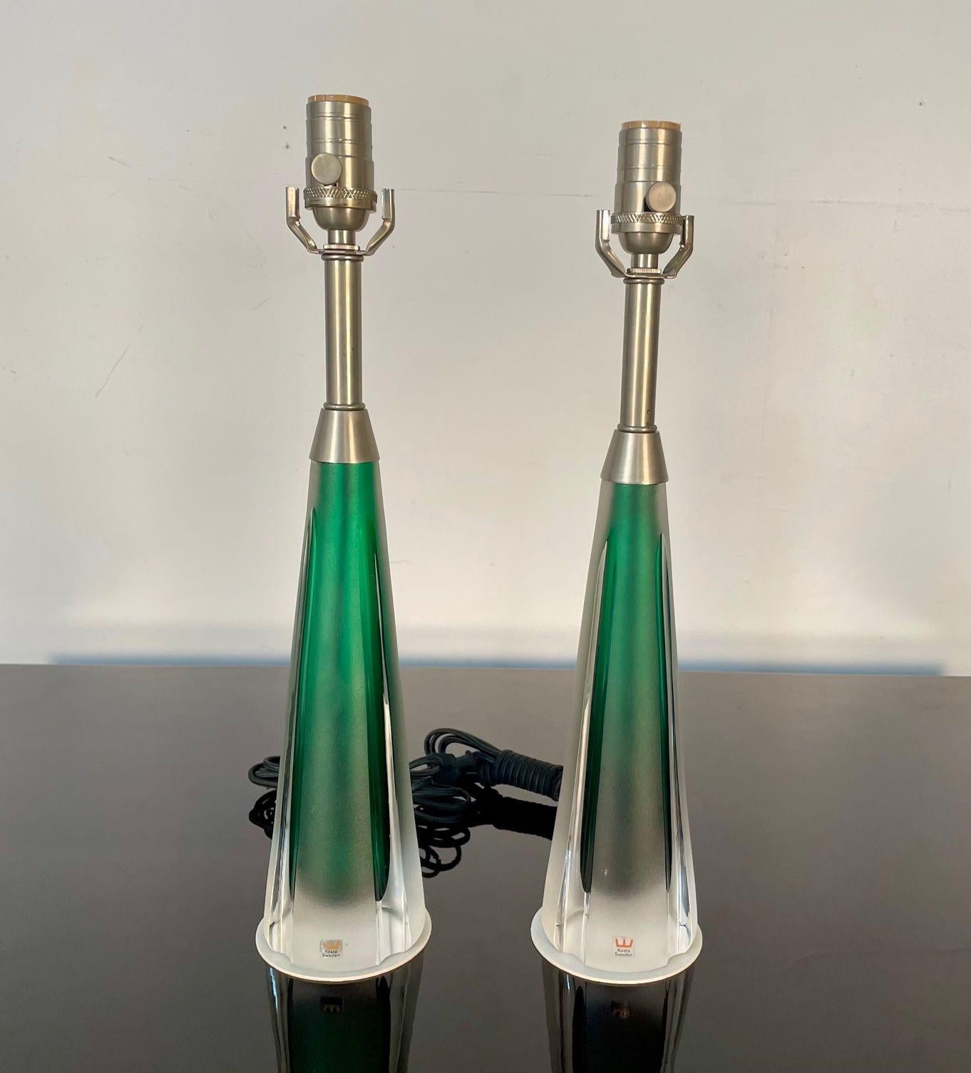 Pair of Swedish Mid-Century Modern Jade Green Kosta Lamps, Perfume Bottle Shape

Pair of perfume shaped smaller table or desk lamps by Vicke Lindstrand for Kosta in a beautiful frosted glass and jade green glass. Maintaining their original KOSTA