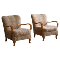 Pair of Swedish Mid Century Modern Lounge Chairs in Birch 
Lambswool, 1960s