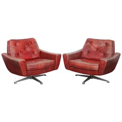 Pair of Swedish Mid-Century Modern Red Leather Swivel Lounge Chairs