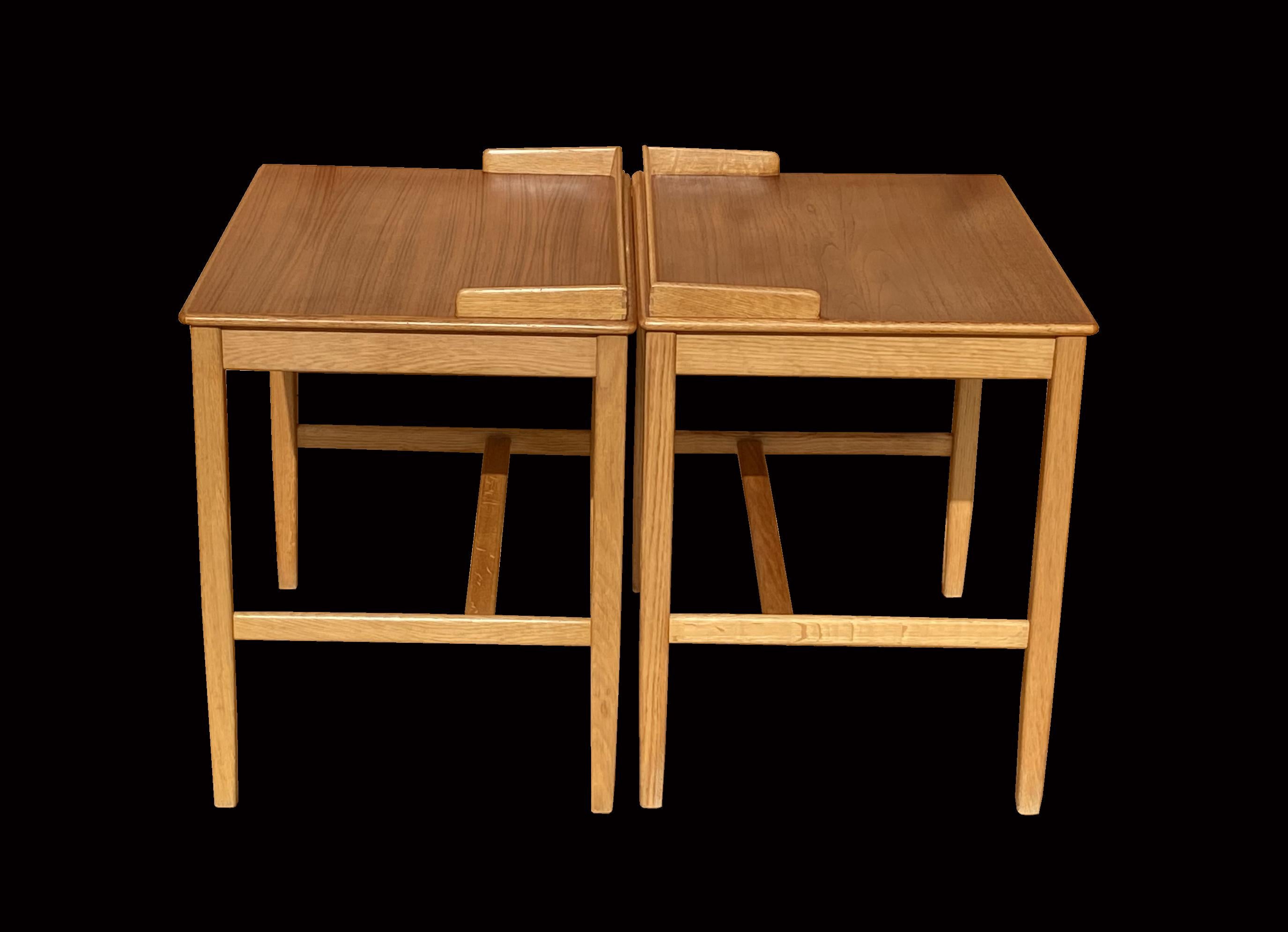 This pair of single drawer tables have teak tops and oak bases, made in Sweden by Tingstroms and retailed by Bra Bohag. They are very nice quality and could easily be used as bedsides, end tables as side or occasional tables.