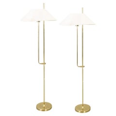 Pair of Swedish Modern Adjustable Height Floor Lamps in Brass