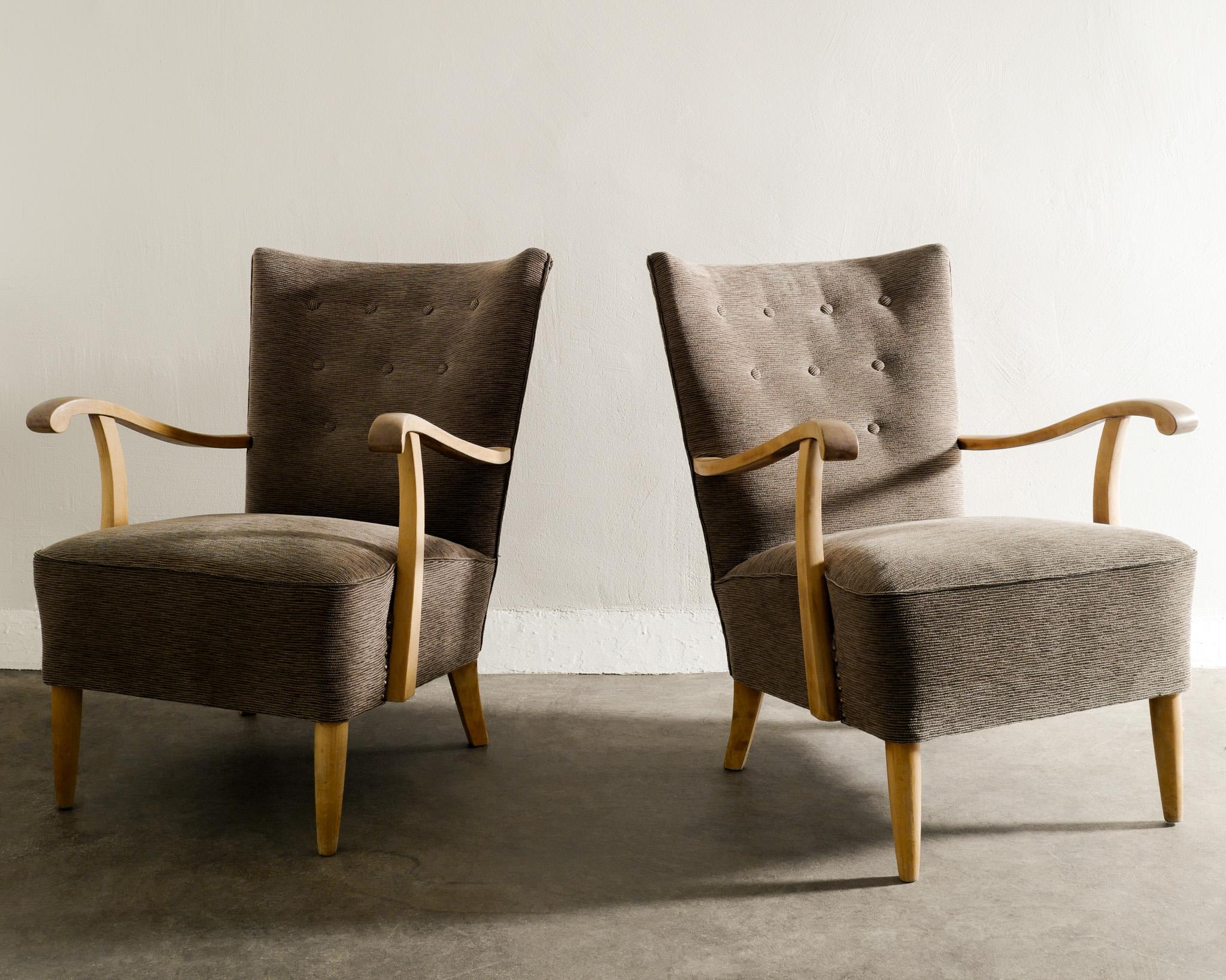 Rare pair of mid century Swedish modern armchairs in beech and newly upholstered brown / gray striped wool fabric. In good matching condition. 

Dimensions: H: 85 cm / 33.5