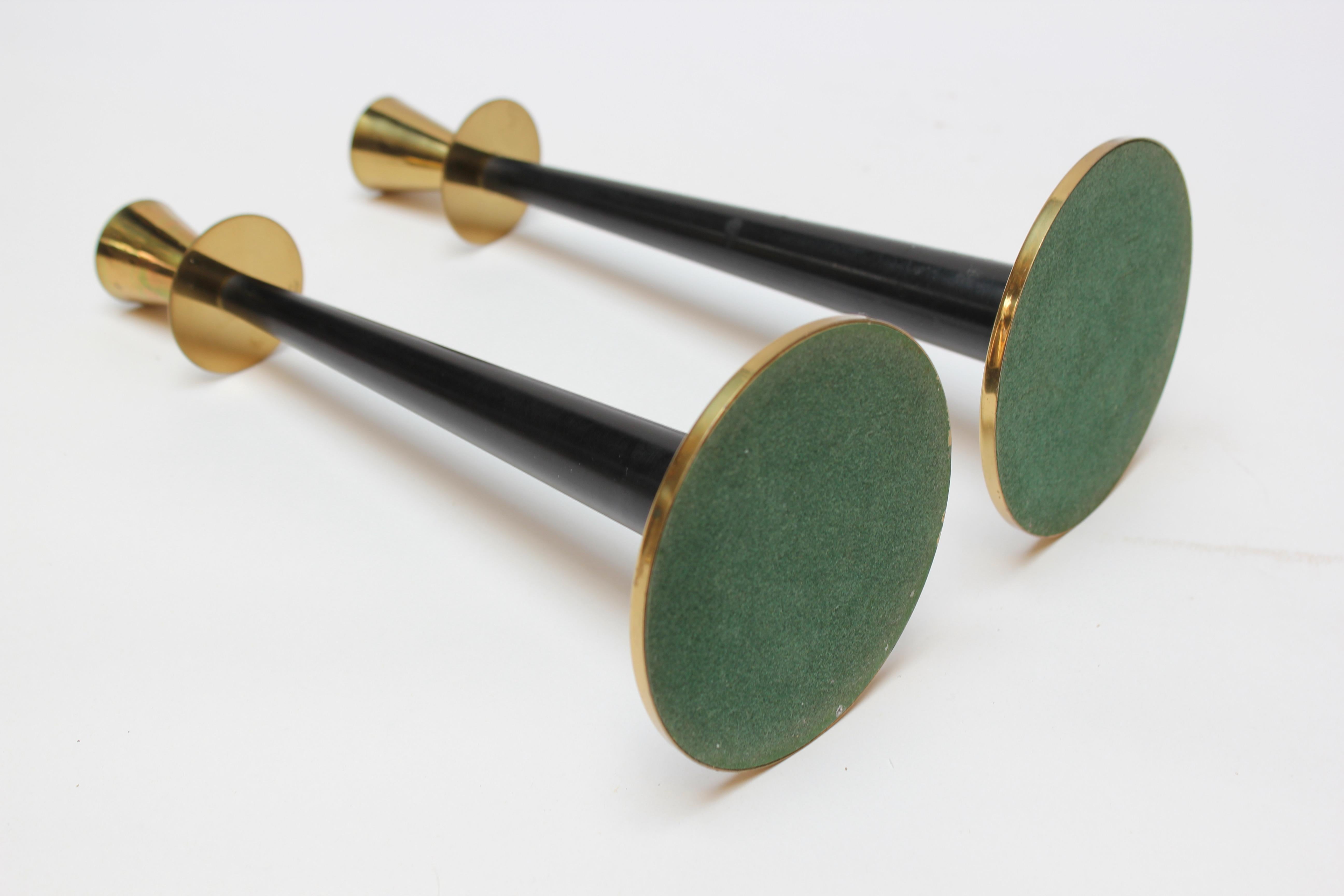 Elegant Swedish Modernist candlesticks by Adam Thylstrup for Nils Johan. Composed of elongated tapers in black bakelite with brass bases and holders. Original, unpolished condition retaining light wear / patina to the brass, along with very minor