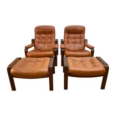 Vintage Pair of Swedish Modern Ergonomic Chairs with Matching Ottomen