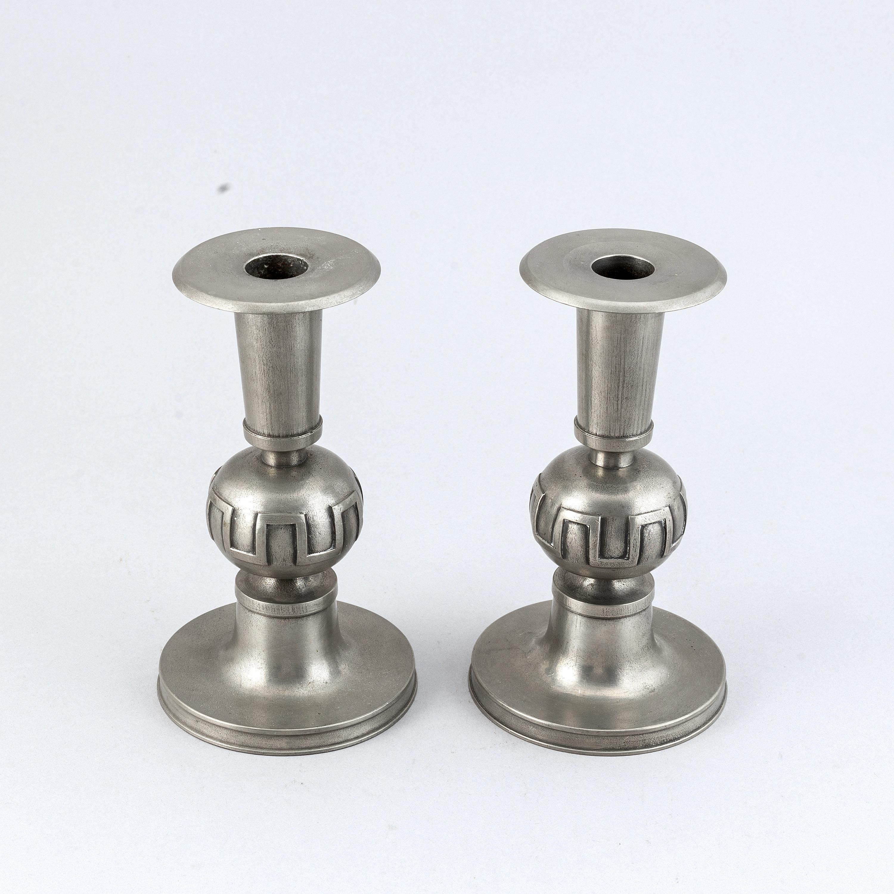 A fine good size pair of Swedish Modern pewter candlesticks designed by Edwin Ollers (1888-1959)
Signed Edwin Ollers with mark and dated 1952. They give a heavy impression and look bigger in real life than the dimensions might give.