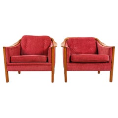 Pair of Swedish modern sculpted teak lounge chairs with upholstery 