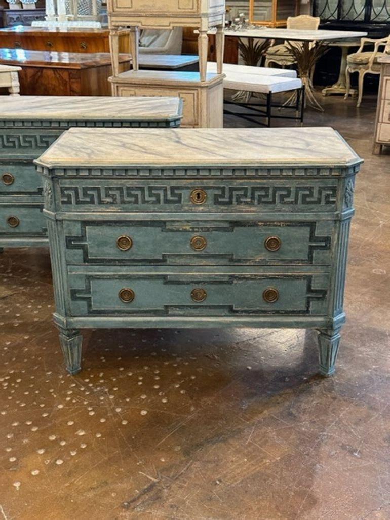 Nice pair of Swedish Neo-Classical style chests painted with a Greek Key design. Very fine patina and a marble top as well.  Superb!!
