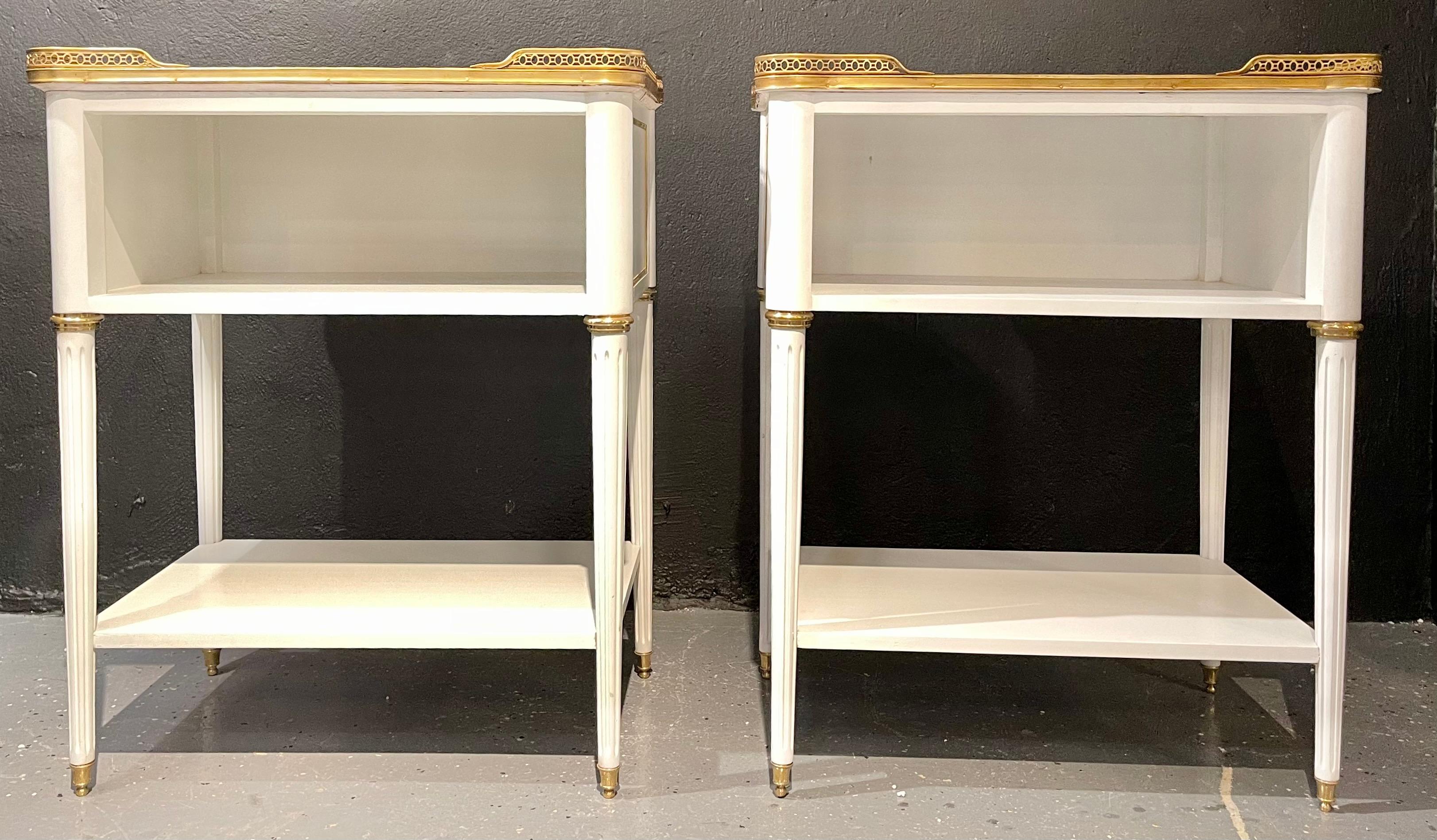 Pair of Swedish neoclassical open nightstands or end tables in the manner of Maison Jansen. These finely crafted open end tables are simply stunning. The Carrara white and gray veined marble tops have rounded corners and sit inside a pierced bronze