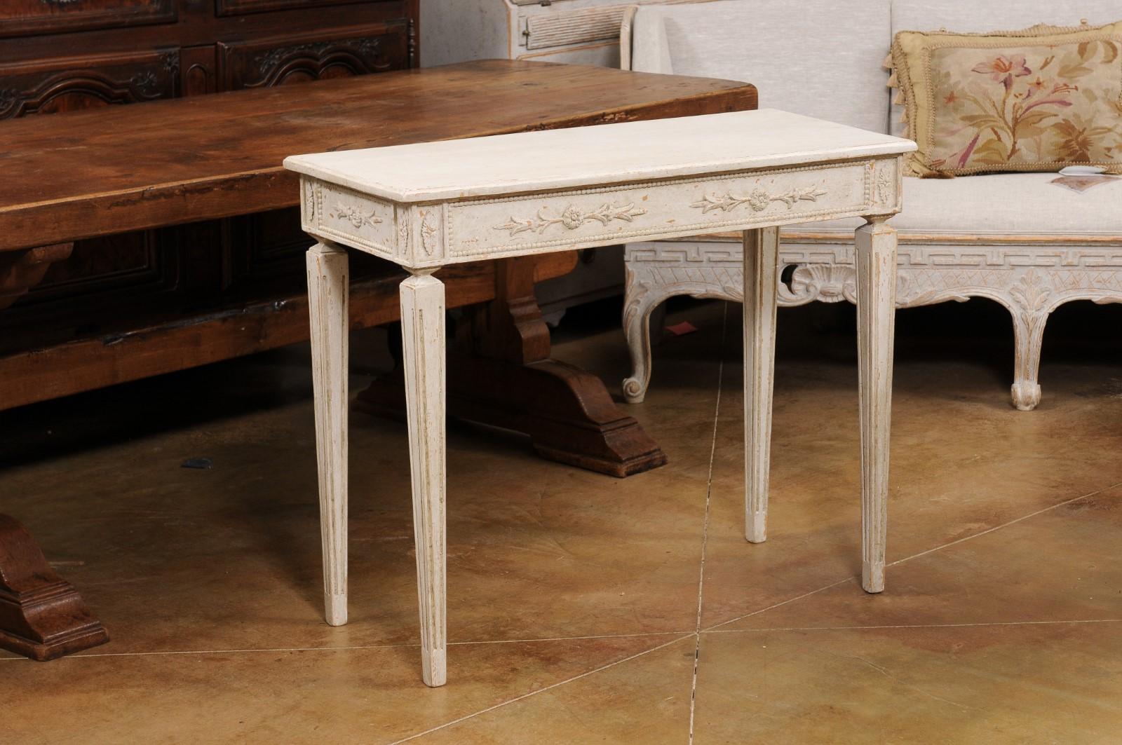 20th Century Pair of Swedish Neoclassical Style Painted Console Tables with Carved Aprons For Sale