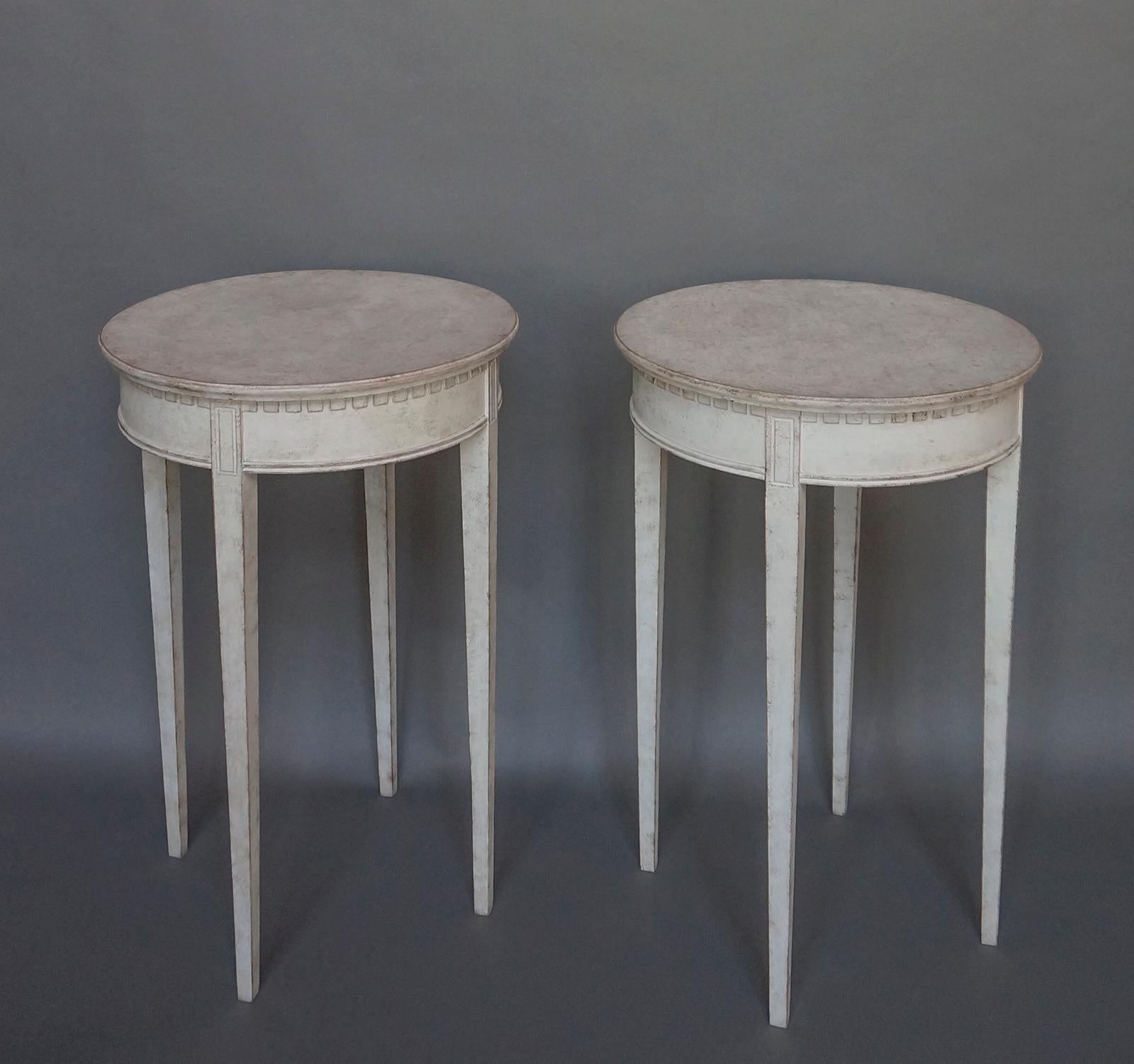 Pair of round occasional tables, Sweden circa 1880, each with four tapered legs and dentil molding under the top. Versatile small size.