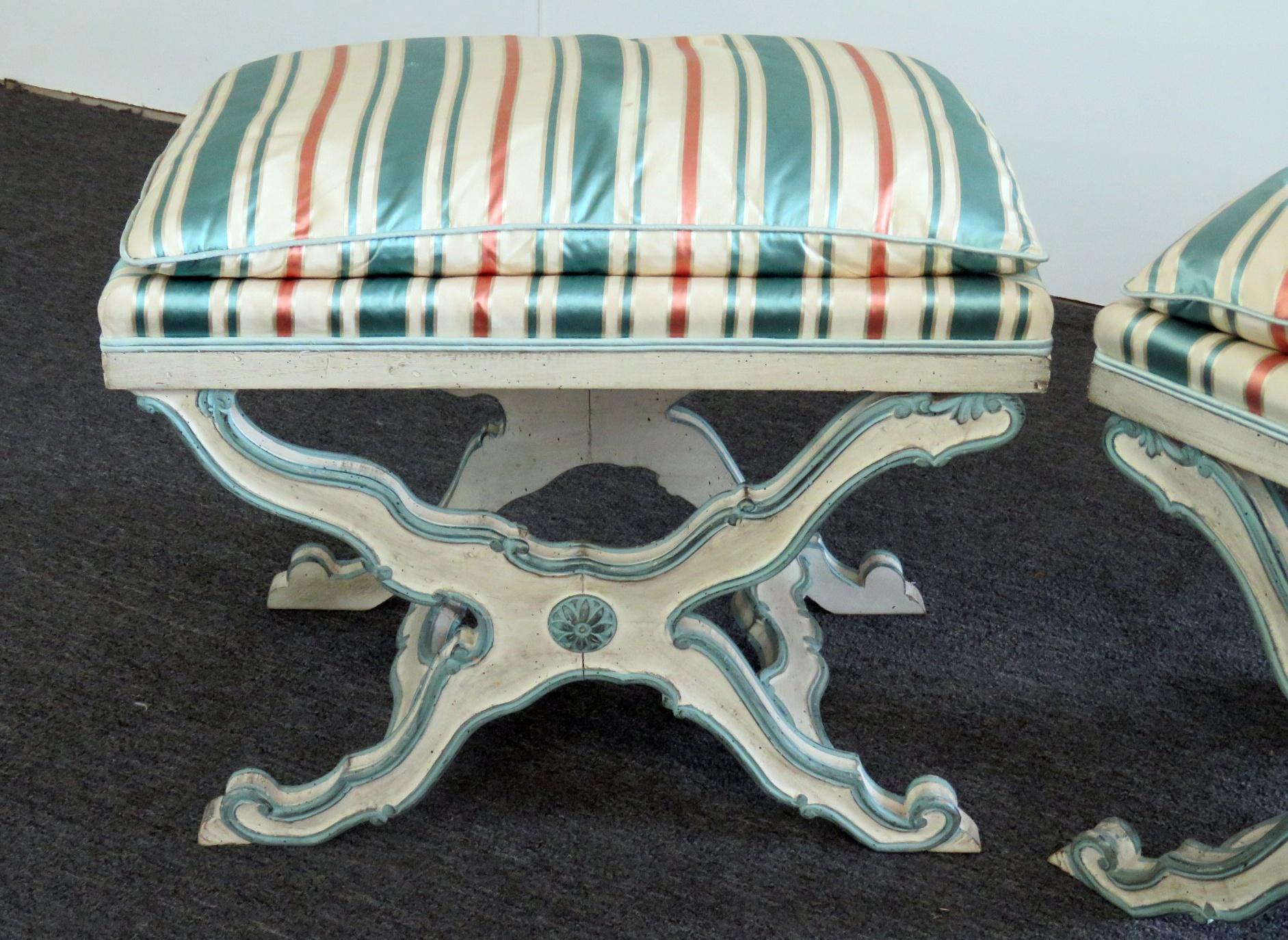 Pair of Swedish distressed paint decorated X benches.