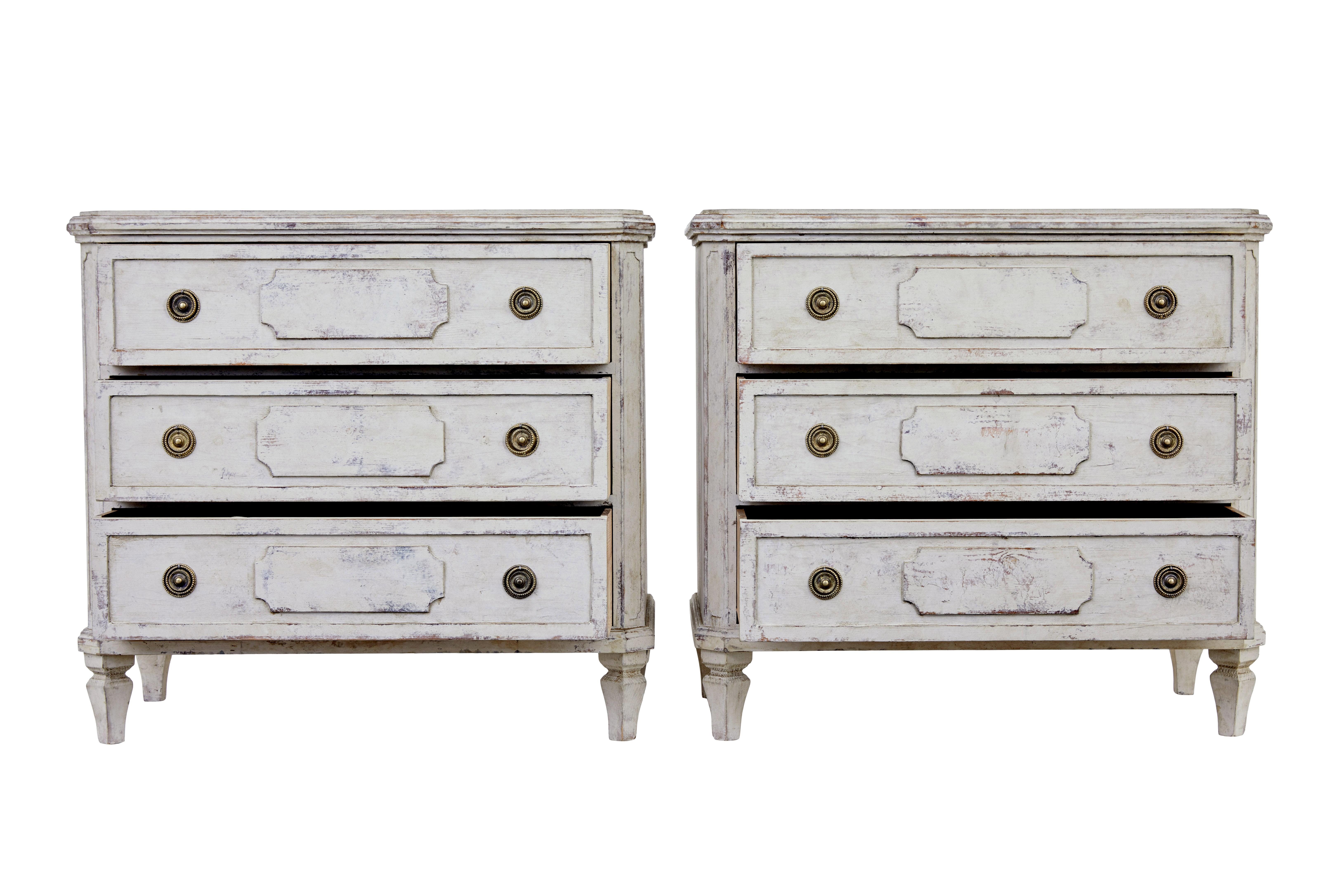 Pair of swedish painted 19th century commodes circa 1880.

Good quality pair of chest of drawers, each fitted with 3 drawers and hand painted in a faded light green colour.

Plain tops with moulded decoration around the edge and canted corners. 
