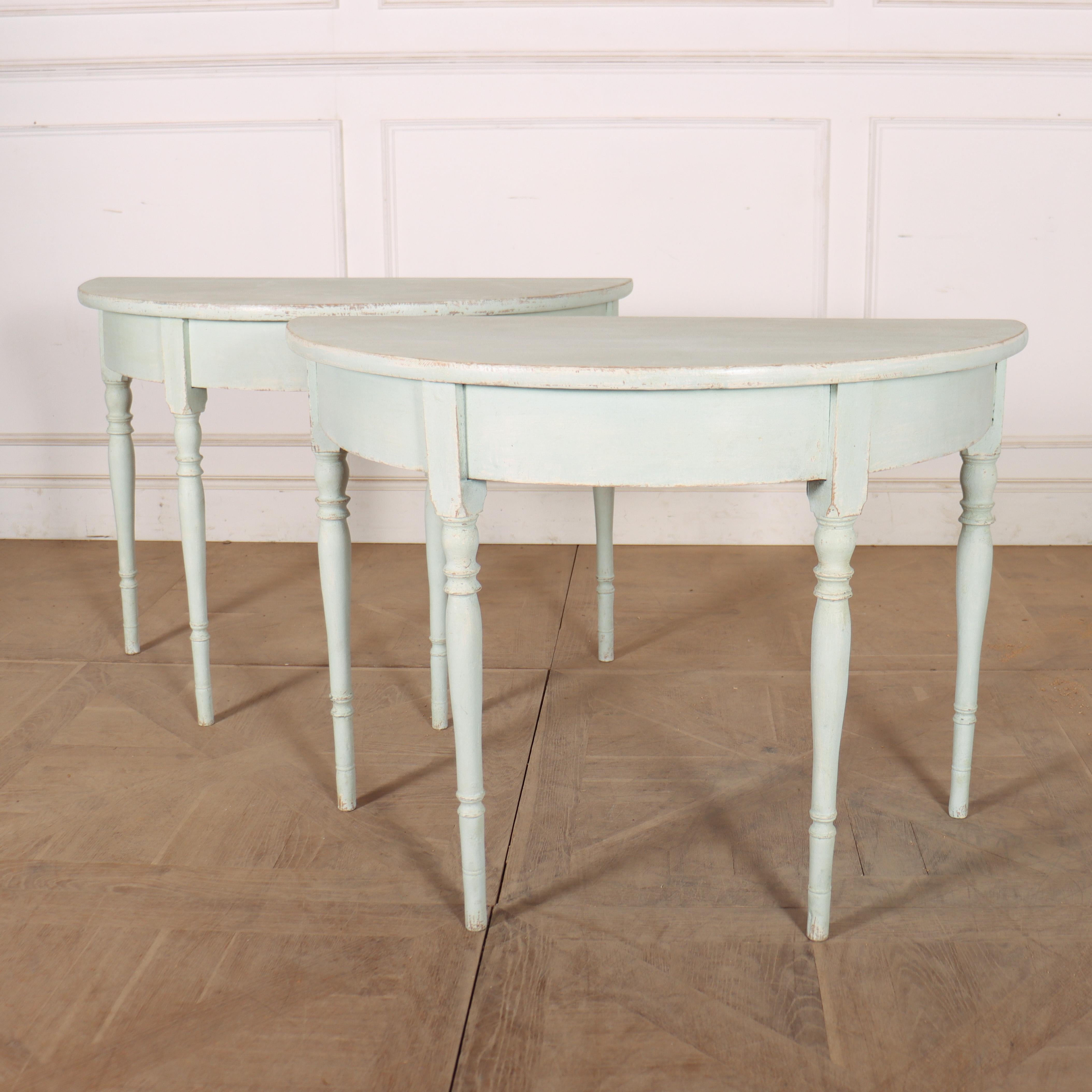 Early 19th century pair of Swedish painted pine demi-lune console tables. 1830. 


Code: 8946

Dimensions:
W: 40.5