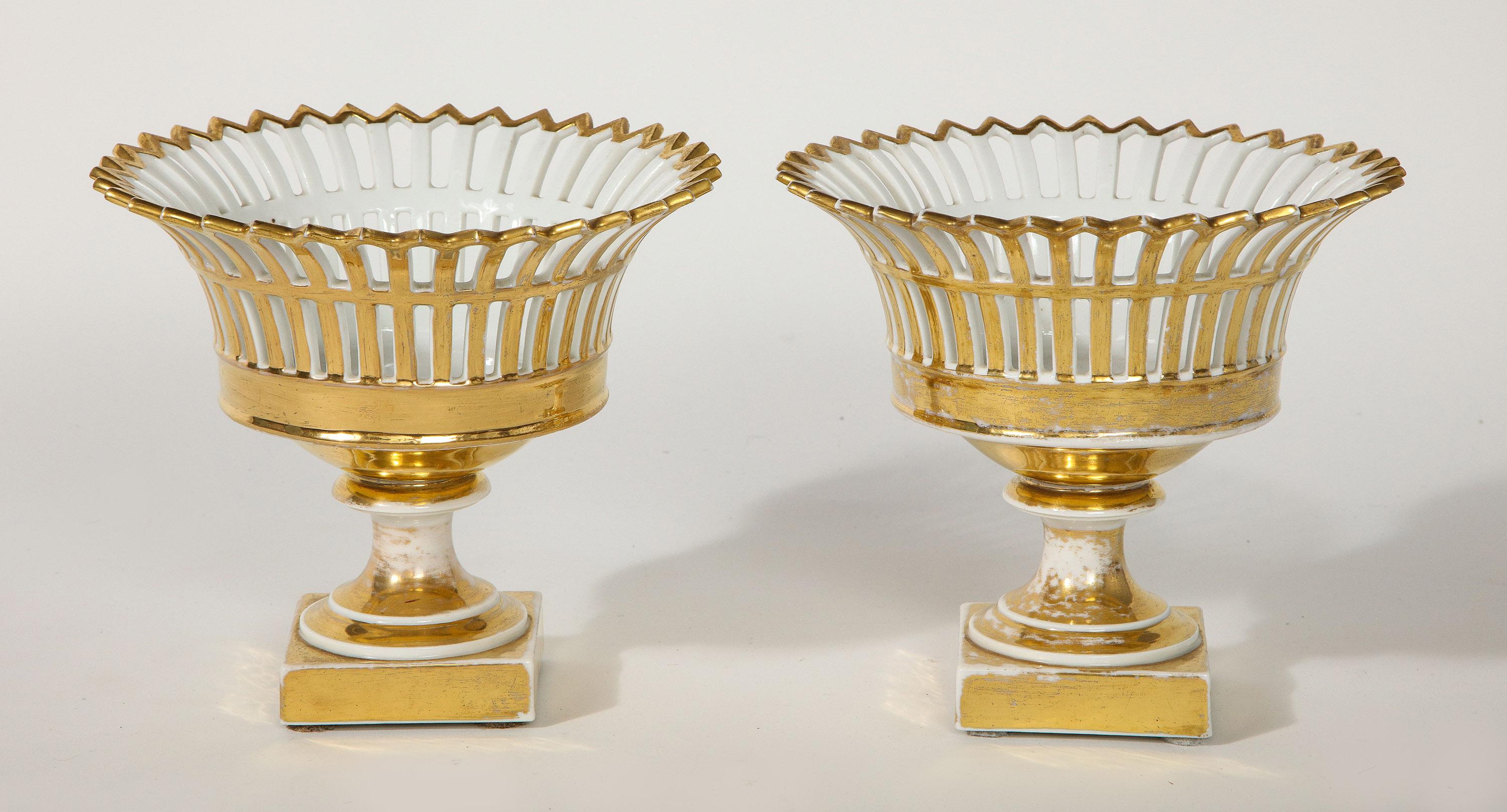 A pair of Swedish porcelain corbeille vases from the Rörstrand Porcelain Factory. Gilded porcelain decorated.