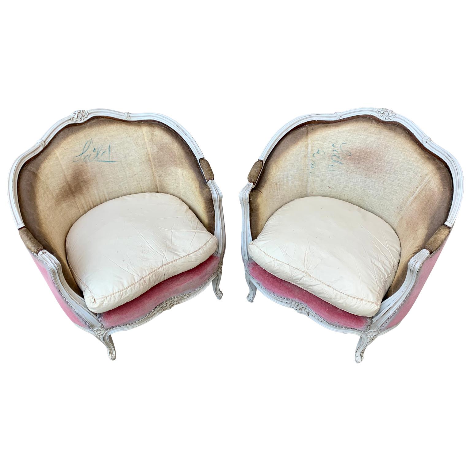 A pair of Swedish bergère armchairs in white painted wooden frame. From the Mid-20th Century in Rococo style and marked 