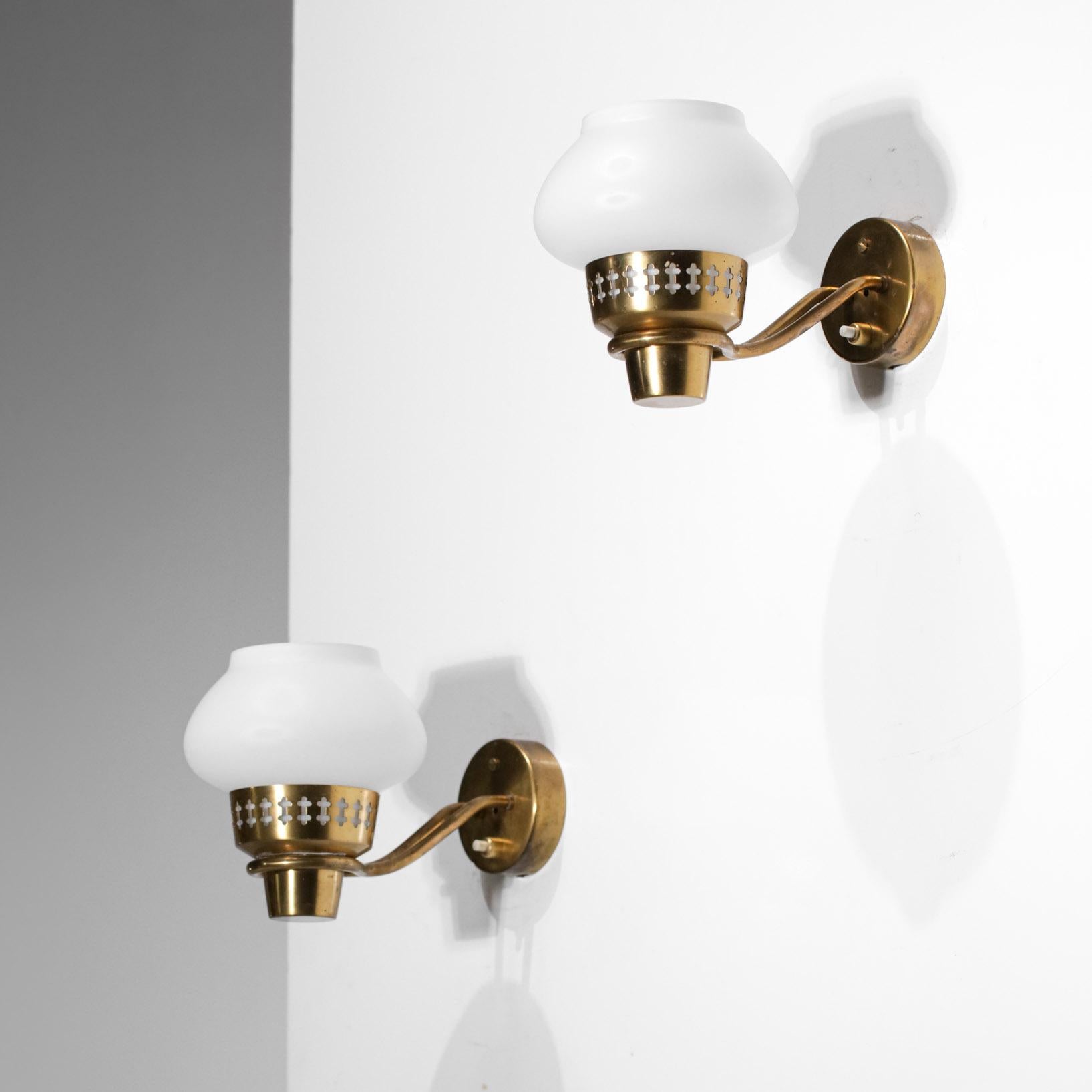 Pair of Scandinavian wall sconces by Swedish designer Hans Bergström. Rare model designed in the 60s. Structure of the sconces in solid brass, diffuser in opaque white opaline, nice model of delicate and decorative sconces. Very nice vintage