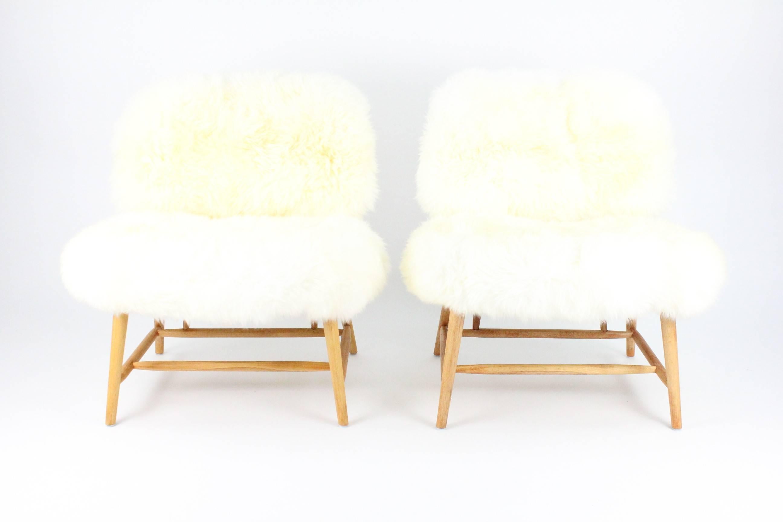 Pair of Swedish Sheep Skin and Beech Teve Easy Chairs by Alf Svensson for DUX 13