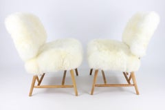 Pair of Swedish Sheep Skin and Beech Teve Easy Chairs by Alf Svensson for DUX