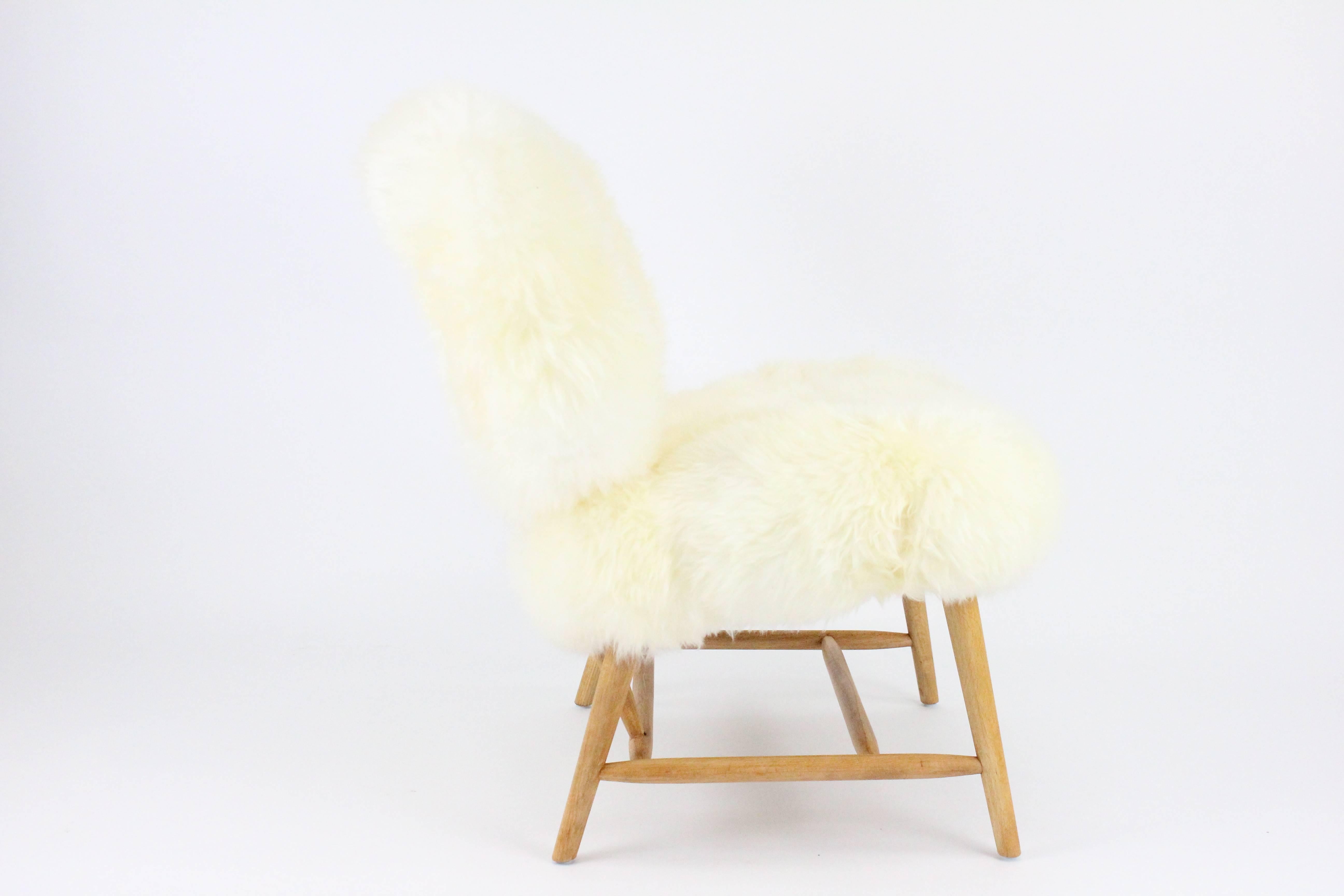 Pair of Swedish Sheep Skin and Beech Teve Easy Chairs by Alf Svensson for DUX 2