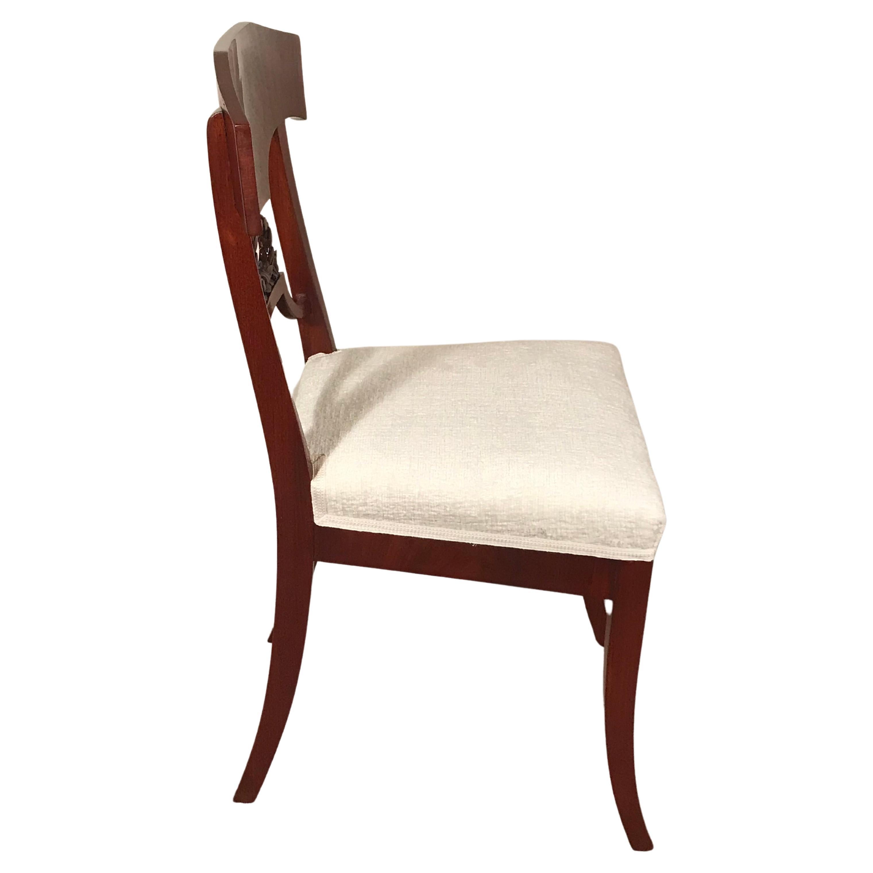Explore the refined charm of this pair of Swedish Gustavian Side Chairs, dating back to the period around 1820-30. With slender legs and a delightful mahogany veneer, these chairs epitomize the grace of the Gustavian style. Adorned with a laurel