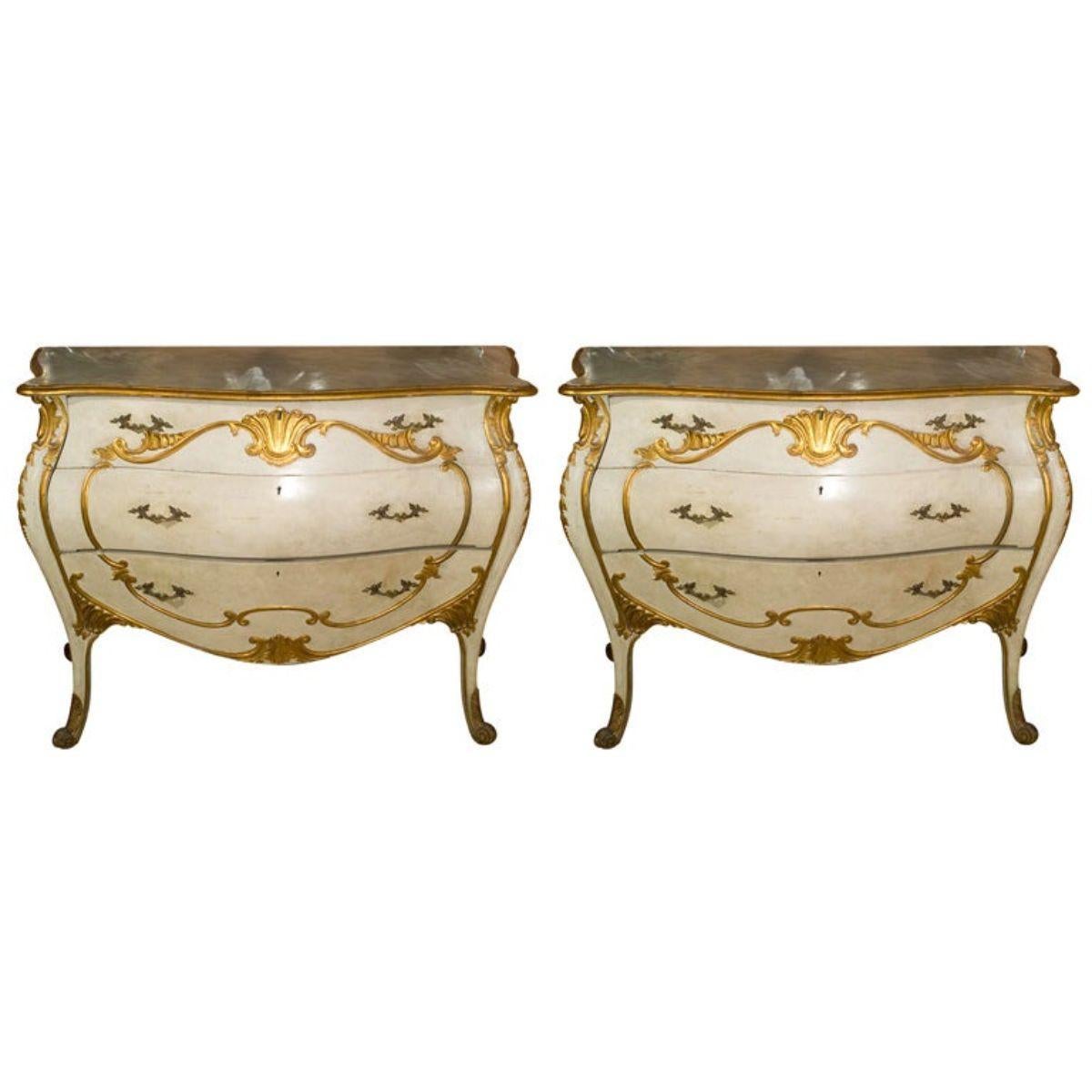 Fabulous pair of Niccolini Bombe Italian painted and gilt decorated commodes. Each done in the Louis XV style, wonderful bombe design, 24-karat gilt decorated. Either can be used as seen or with matching white marble tops conforming to each piece.