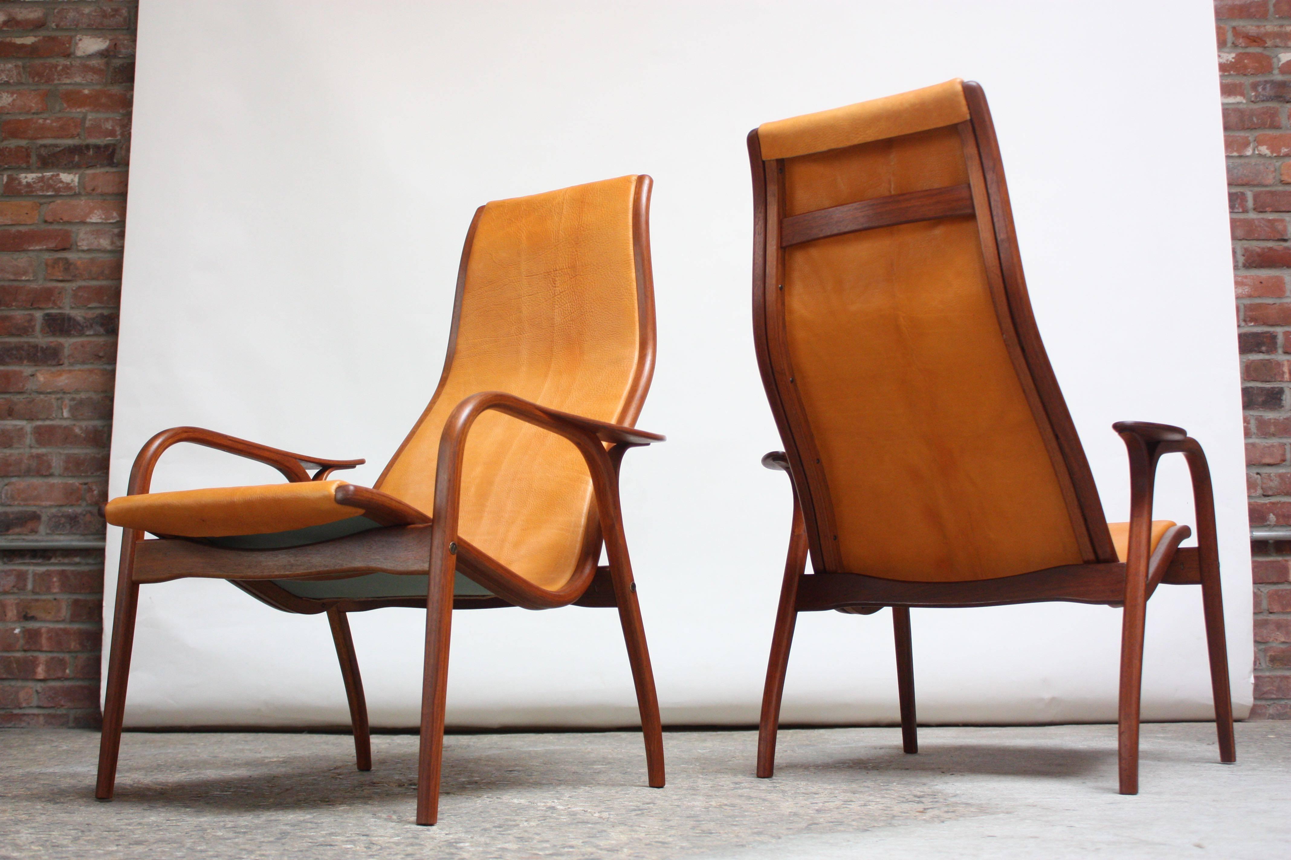 Yngve Ekström 'Lamino' Chairs for ESE-Möbler / Swedese, circa 1956, Sweden. Composed of laminated teak frames and newly upholstered in leather. The hides used are vintage (1970s) and very dense; the leather will age and thin nicely over time. The
