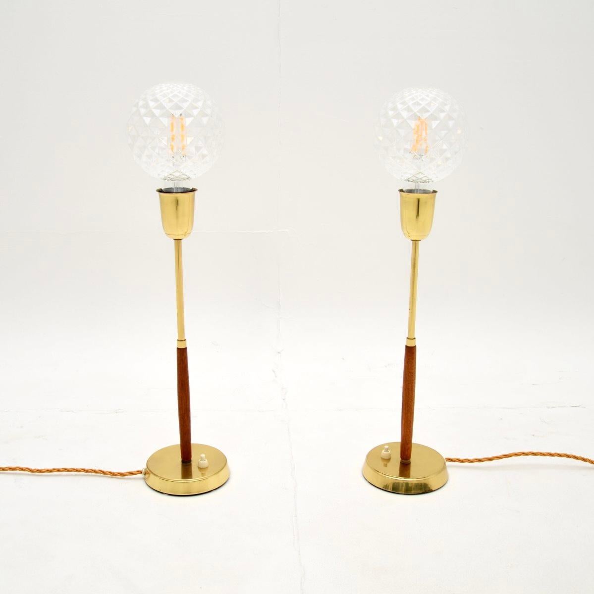 A smart and stylish pair of Swedish vintage teak and brass table lamps. They were recently imported from Sweden, they date from around the 1960’s.

The quality is superb, they are a beautifully designed and are a lovely size. The solid teak central