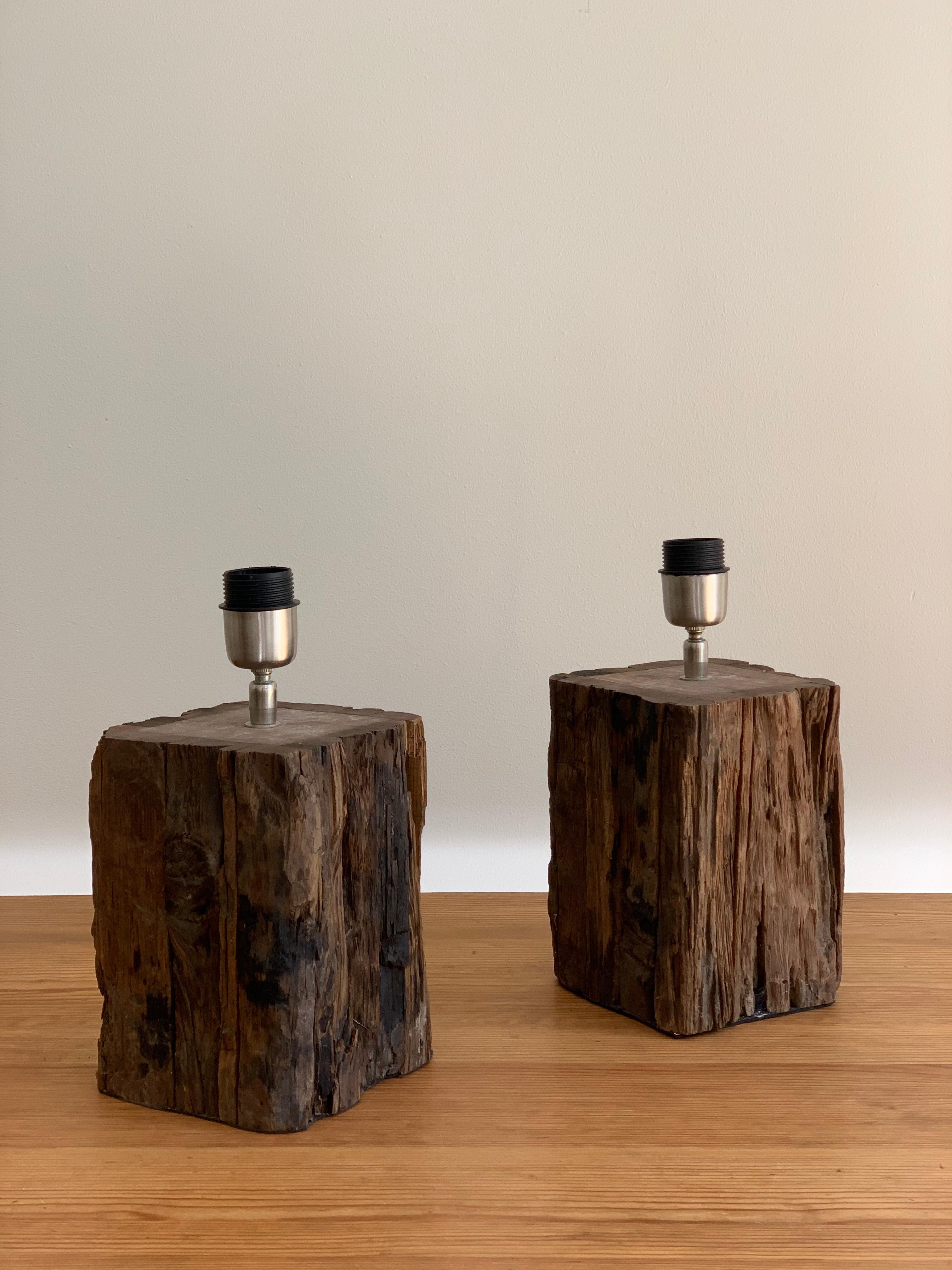 Pair of wooden and unique table lamps made out of wood. Newer wiring. 
In good condition with minimal signs of use. 
Made in Sweden by unknown designer. 

Measures: 30 cm tall without the shade. 

Shades excluded in the purchase.