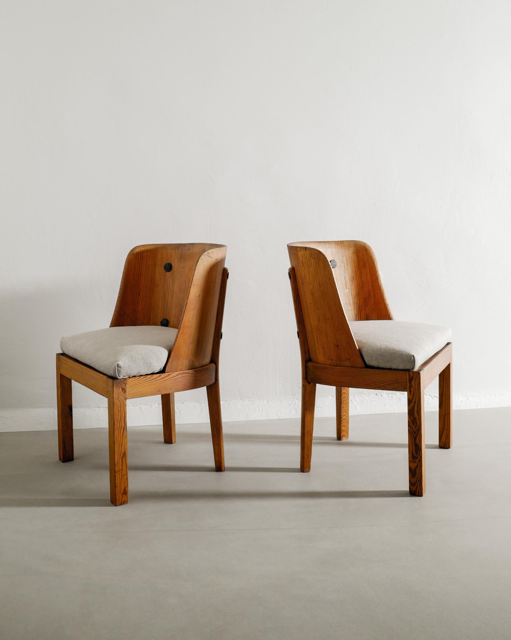 Very rare pair of Swedish wooden low back armchairs in stained pine model 