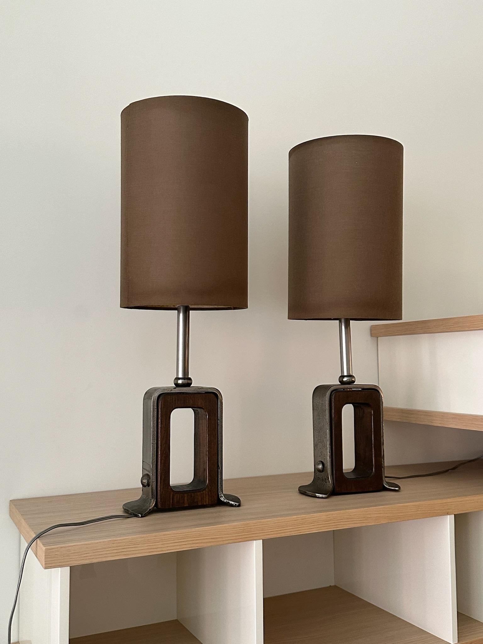 Pair of Swiss metal and wood desk lamps with brown linen shade. Shades show beautiful patina, but could also be replaced for a more pristine look. Lamps need to be rewired to meet US standards. 

Lamp base: 7 x 3.25 x 14
Lamp shade: 8 x 8 x 12