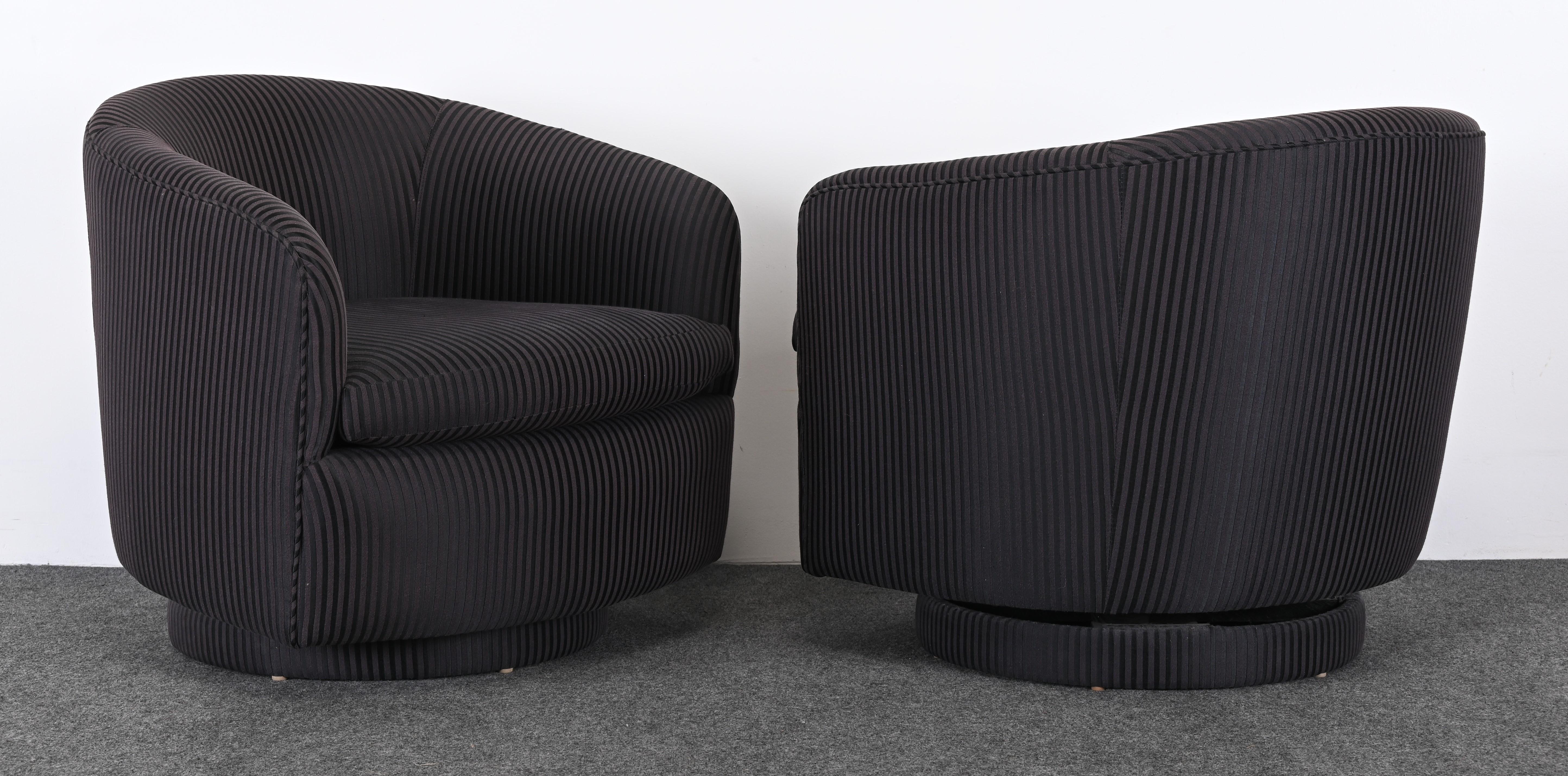 A pair of chic black and grey striped swivel chairs by Milo Baughman for Thayer Coggin, 1990s. The fabric has been newly upholstered five years ago by the original owners. These handsome swivel and rock chairs are very pleasing and ready to place.
