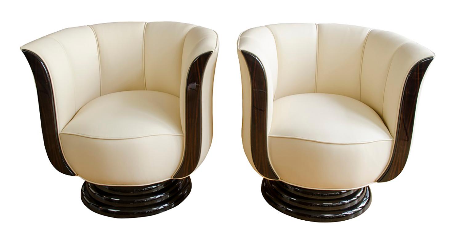 European Pair of swivel chairs upholstered in light leather For Sale