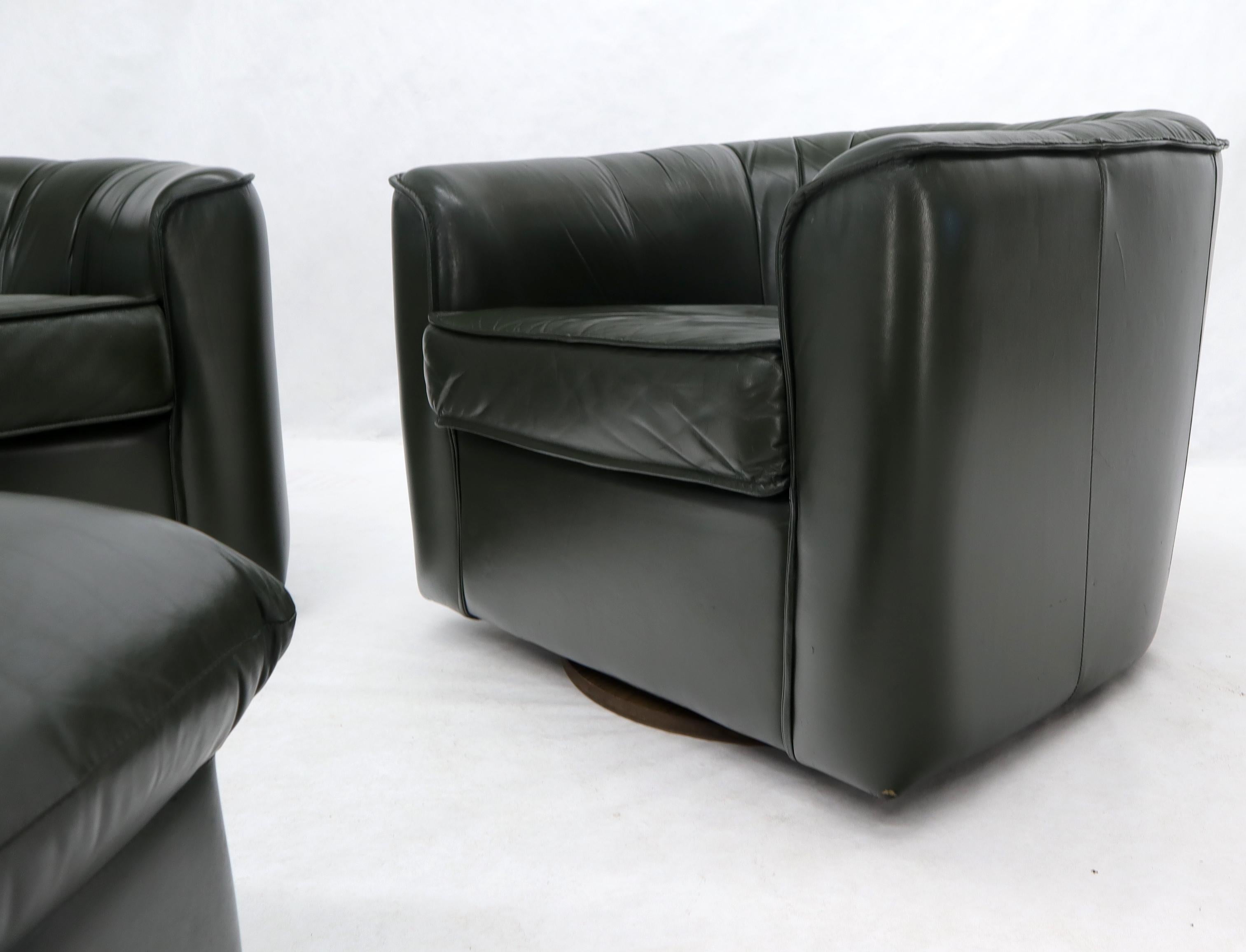 20th Century Pair of Swivel Dark Olive Green Leather Upholstery Lounge Chairs with Ottoman